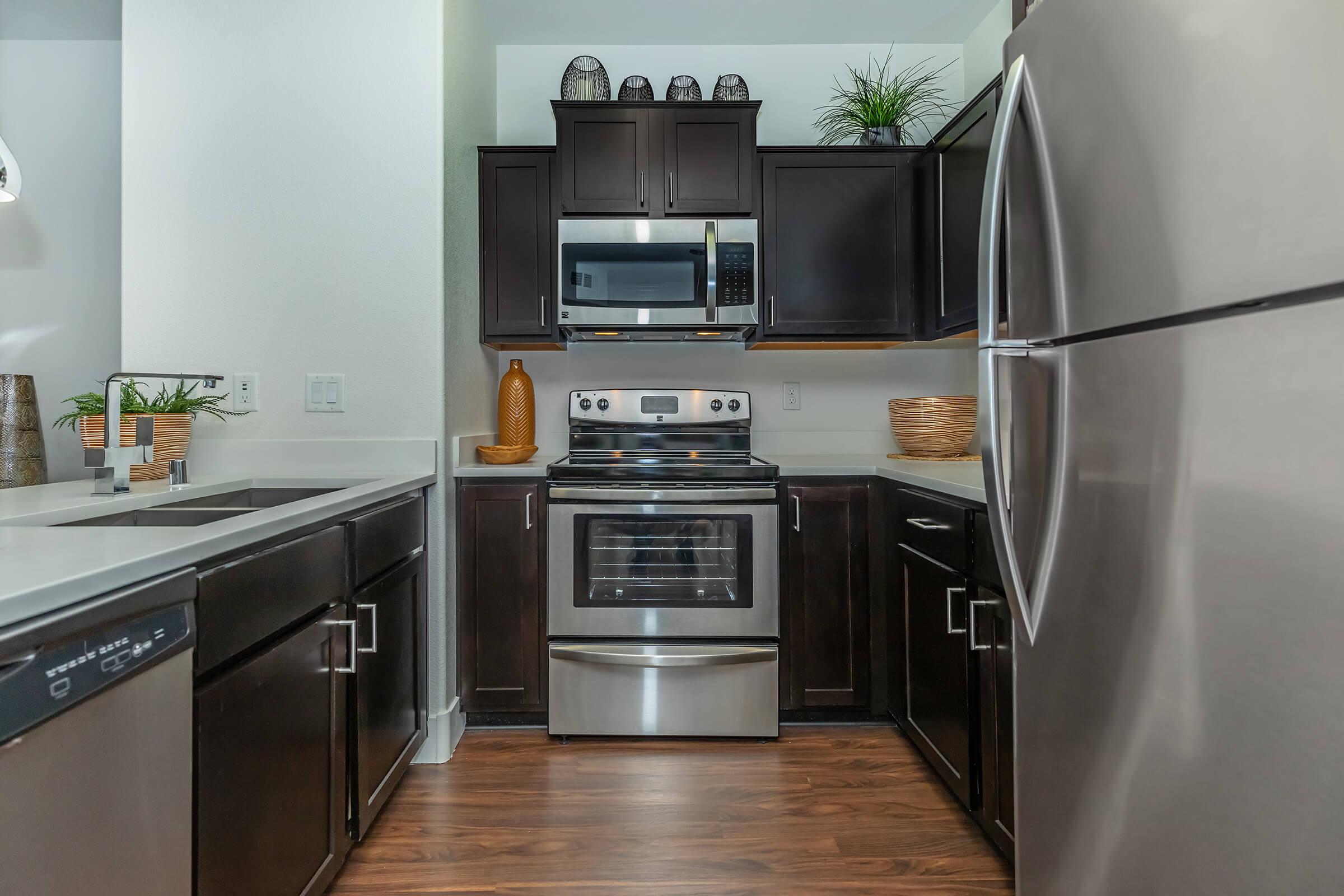 a modern kitchen with stainless steel appliances