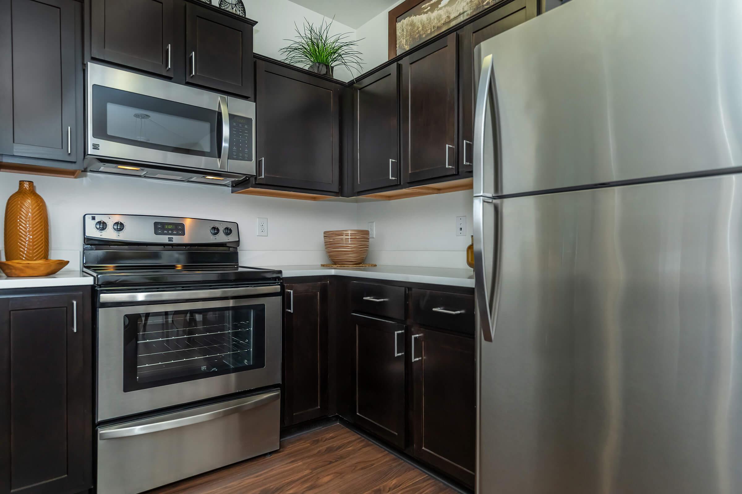 a stainless steel refrigerator in a kitchen