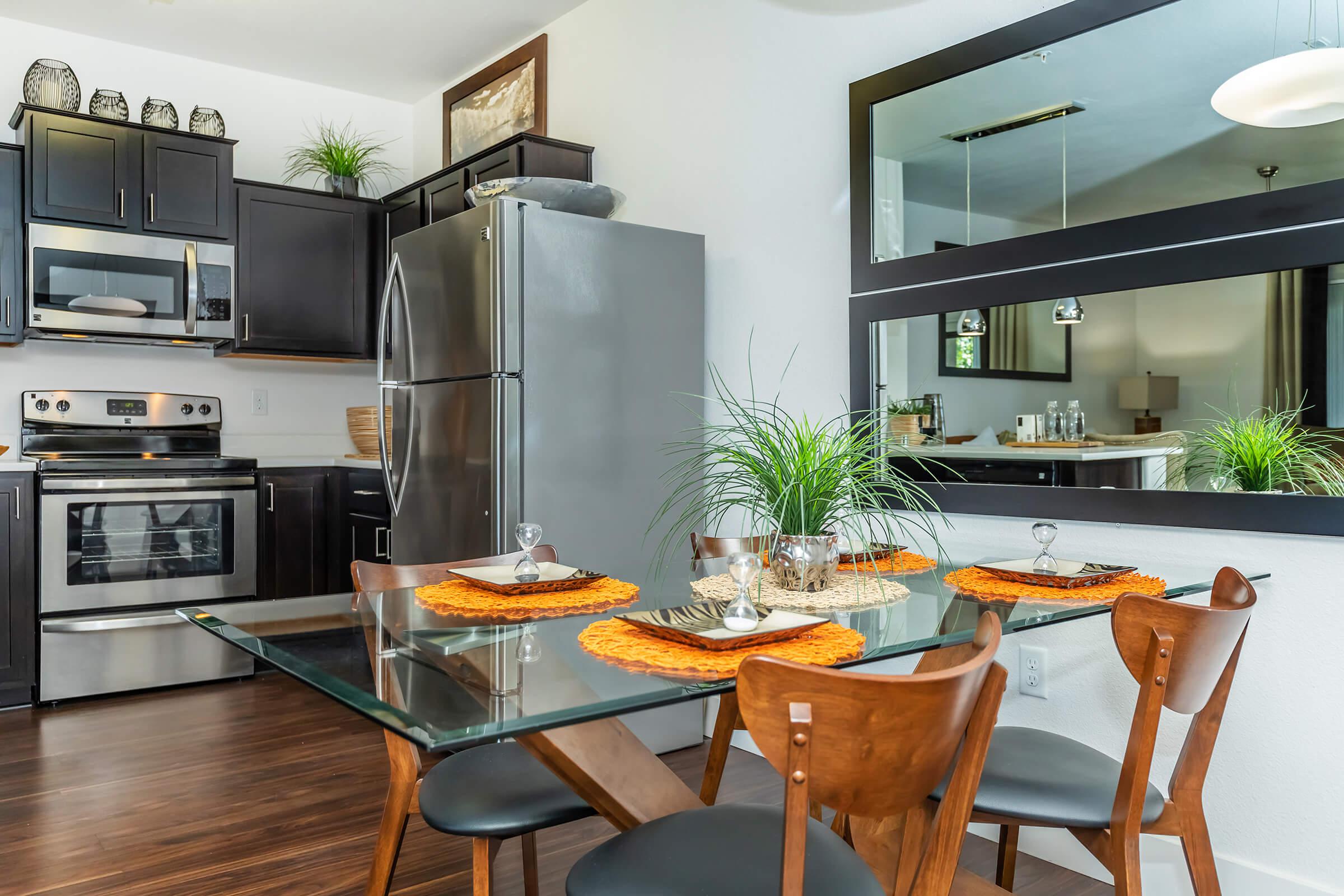 a kitchen with a dining table