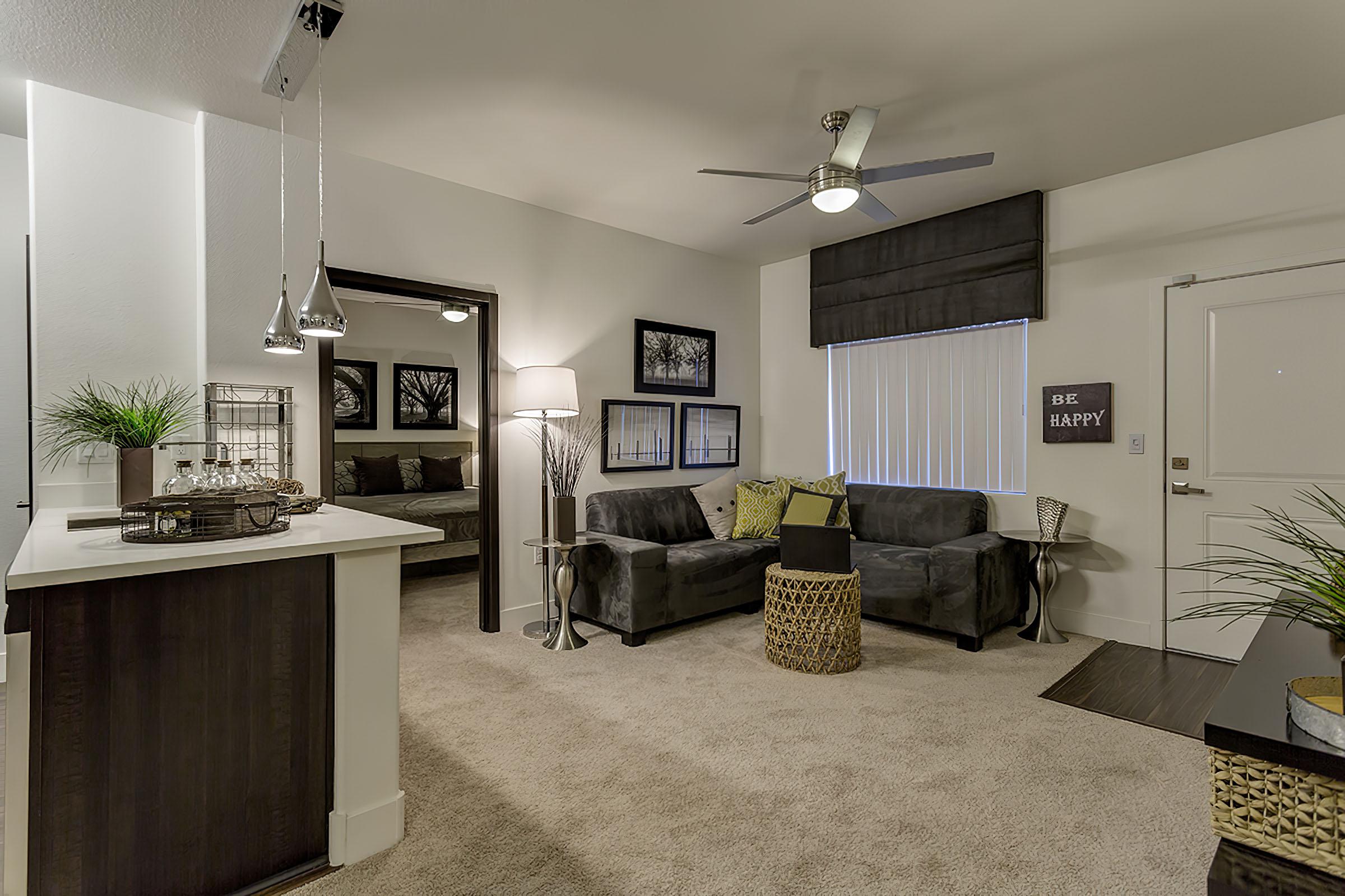 a living room filled with lots of furniture