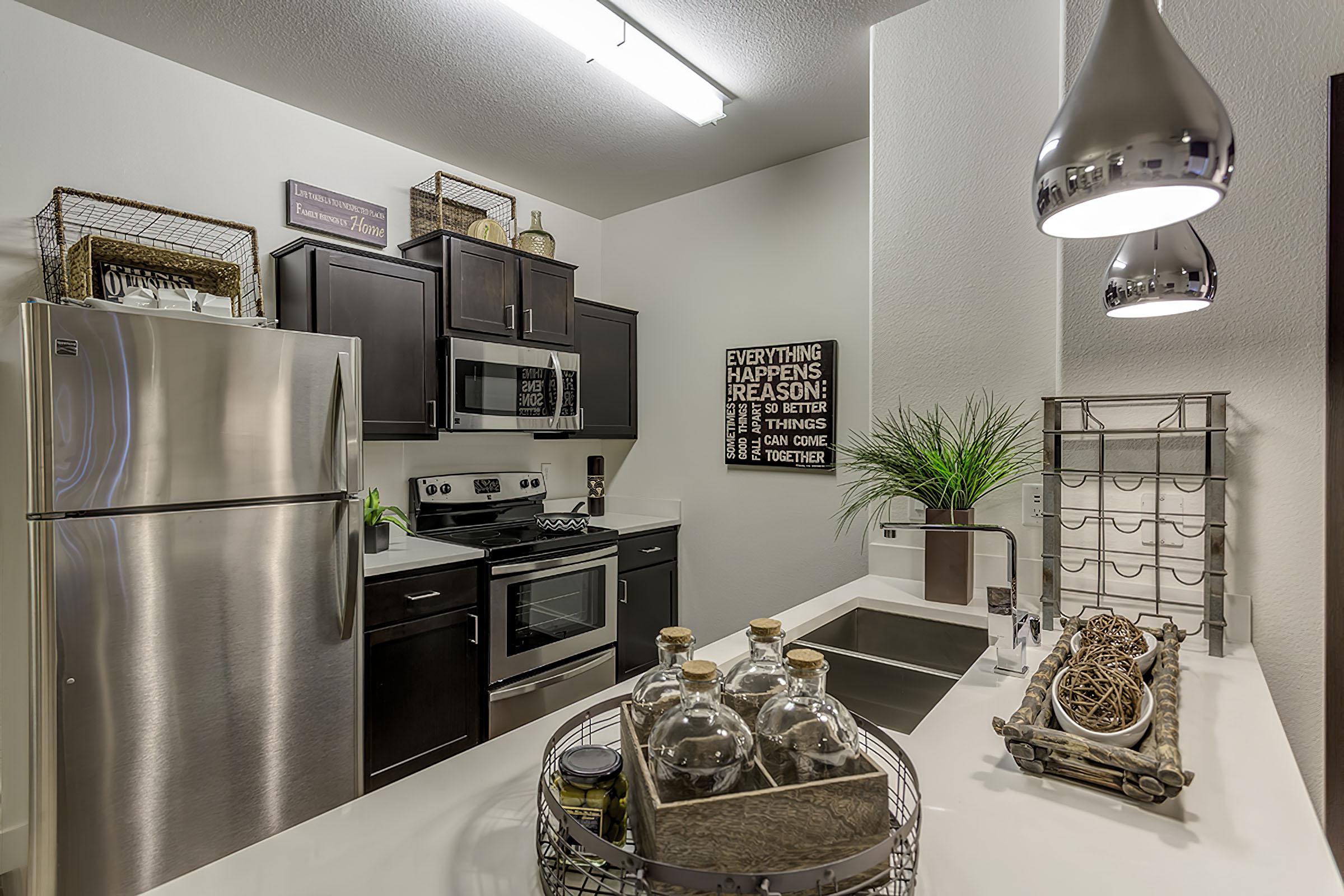 a modern kitchen with stainless steel appliances