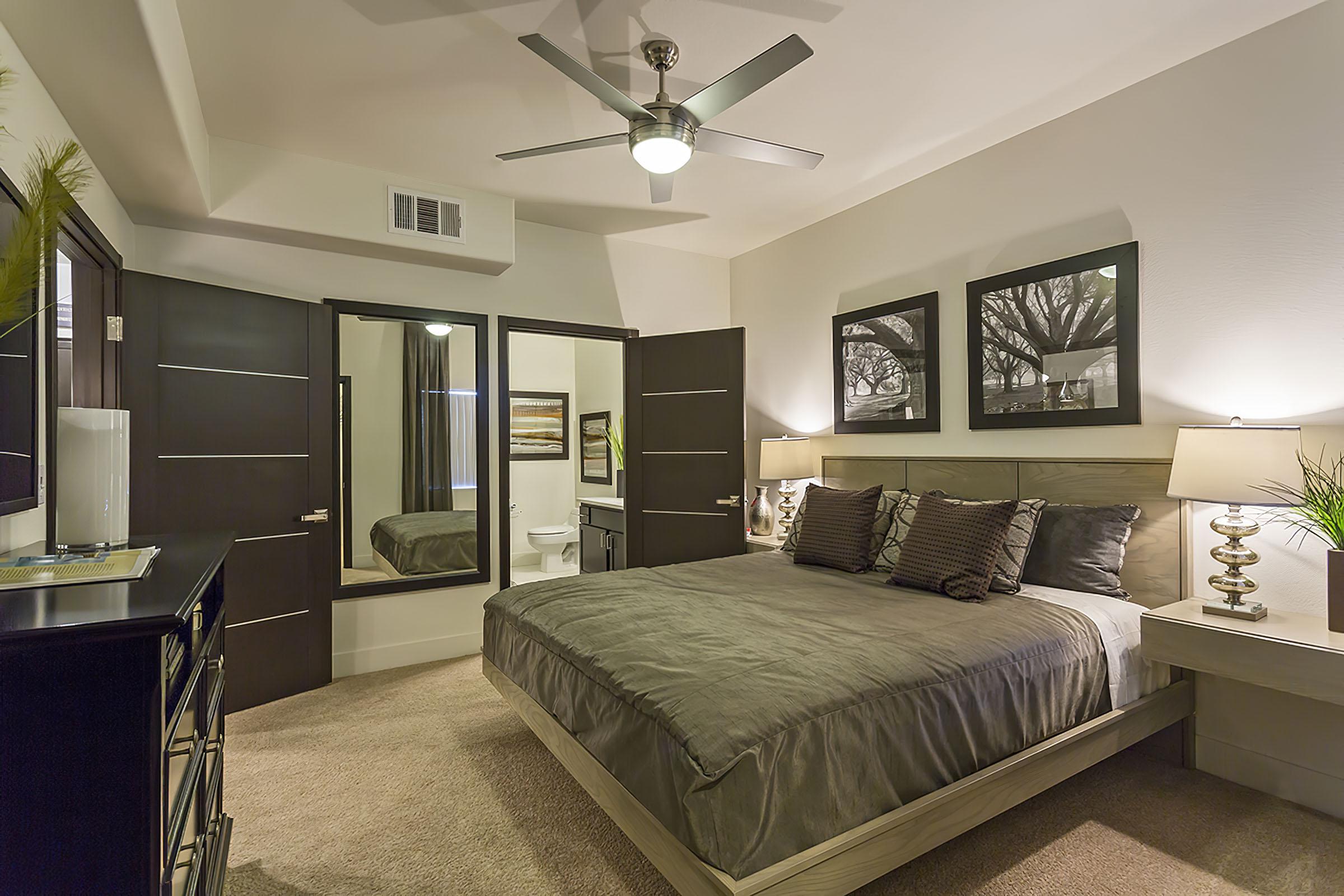 a bedroom with a large bed in a hotel room