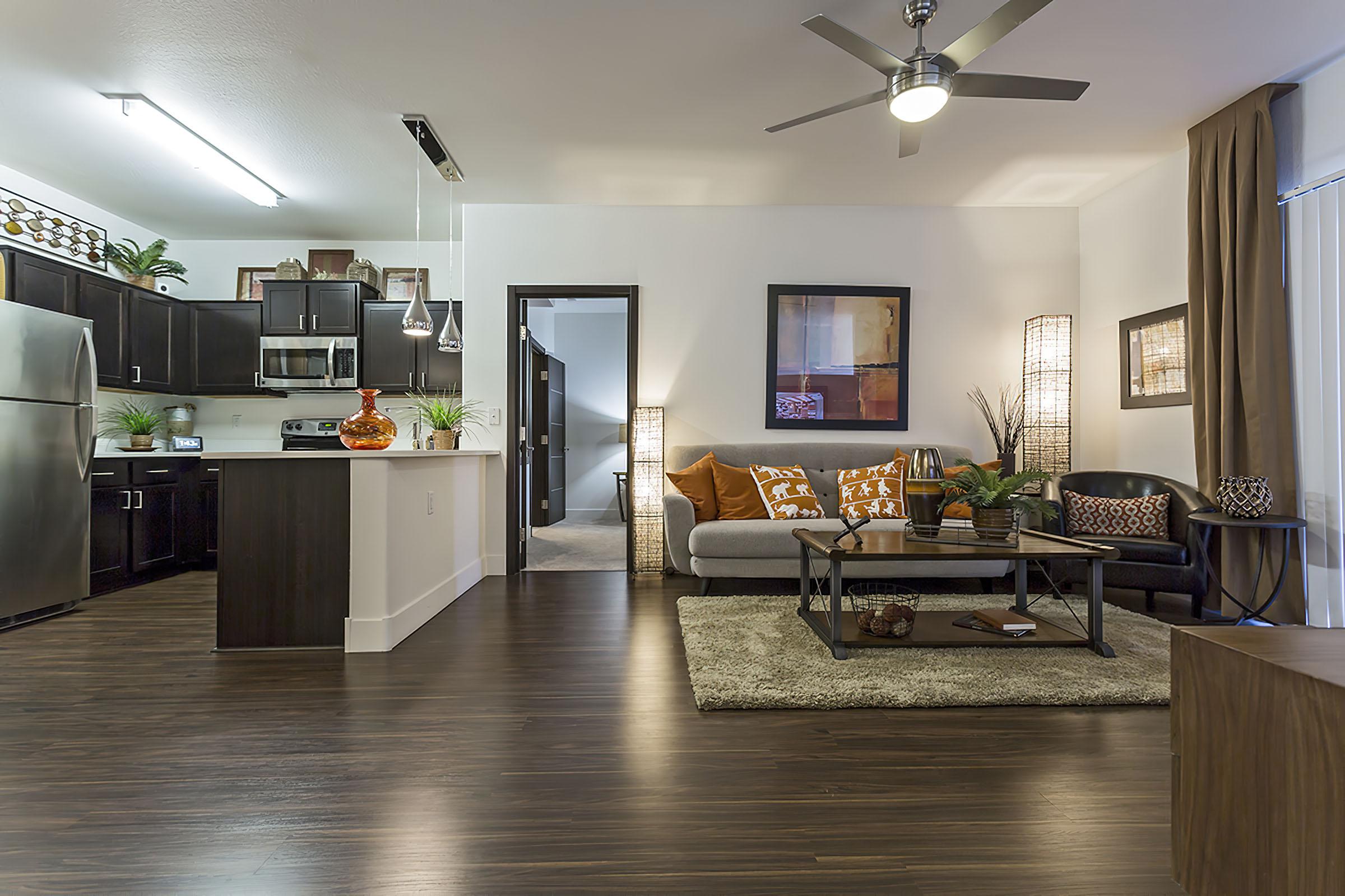 a living room filled with furniture and a fireplace