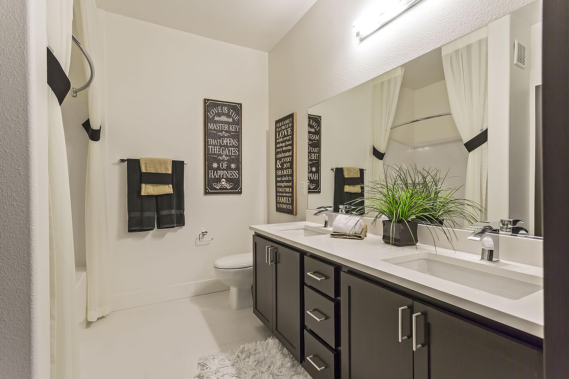 a kitchen with a sink and a mirror