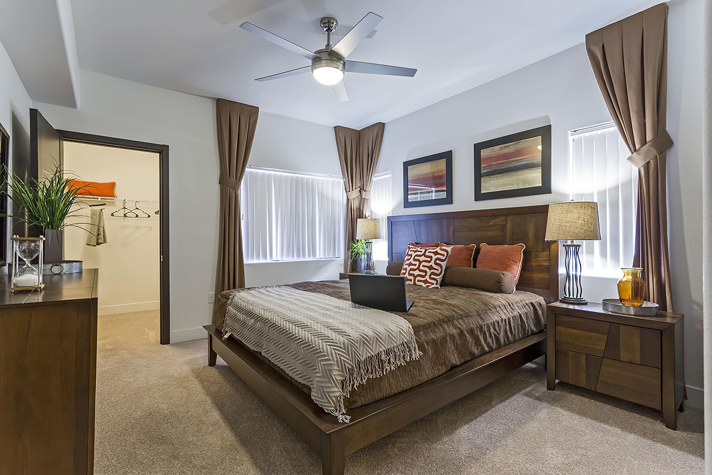 a living room filled with furniture and a flat screen tv