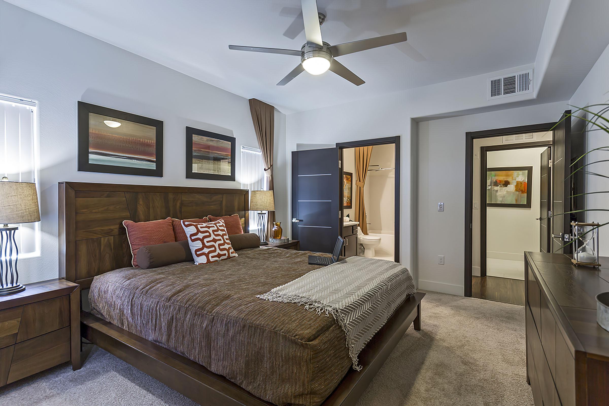 a bedroom with a large bed in a hotel room