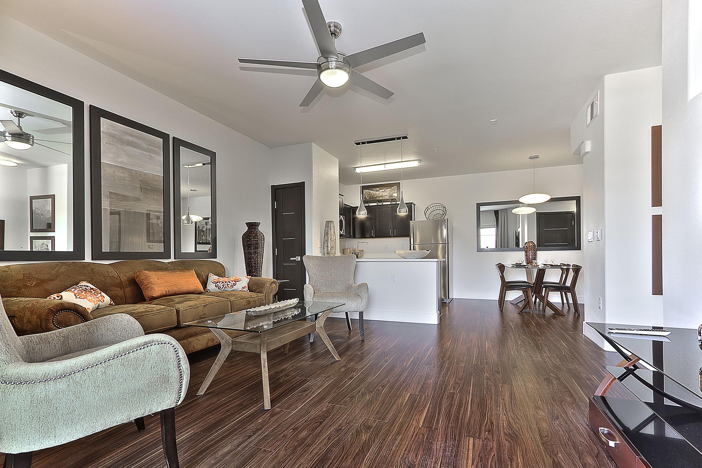 a living room filled with furniture and a tv