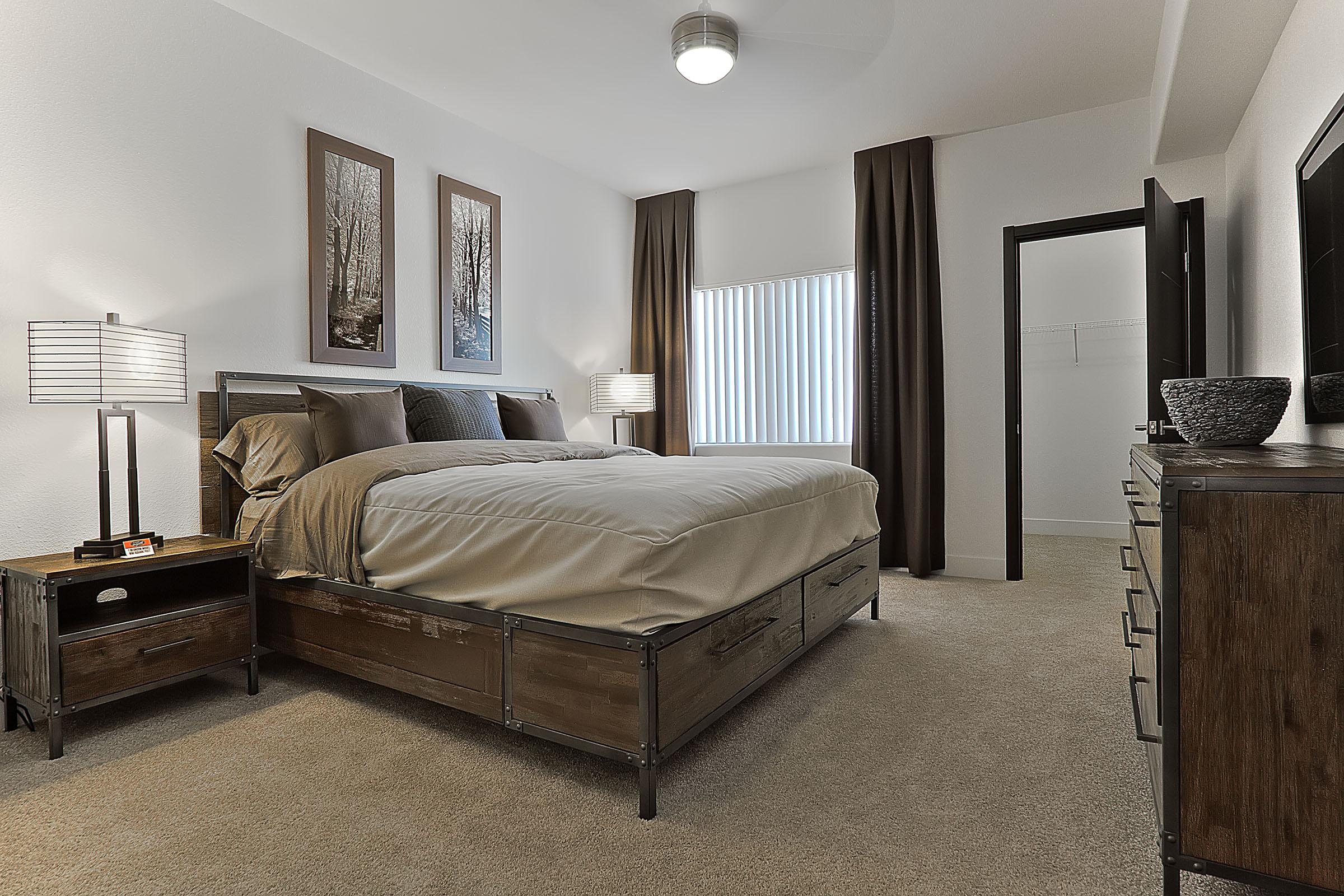 a bedroom with a bed in a hotel room