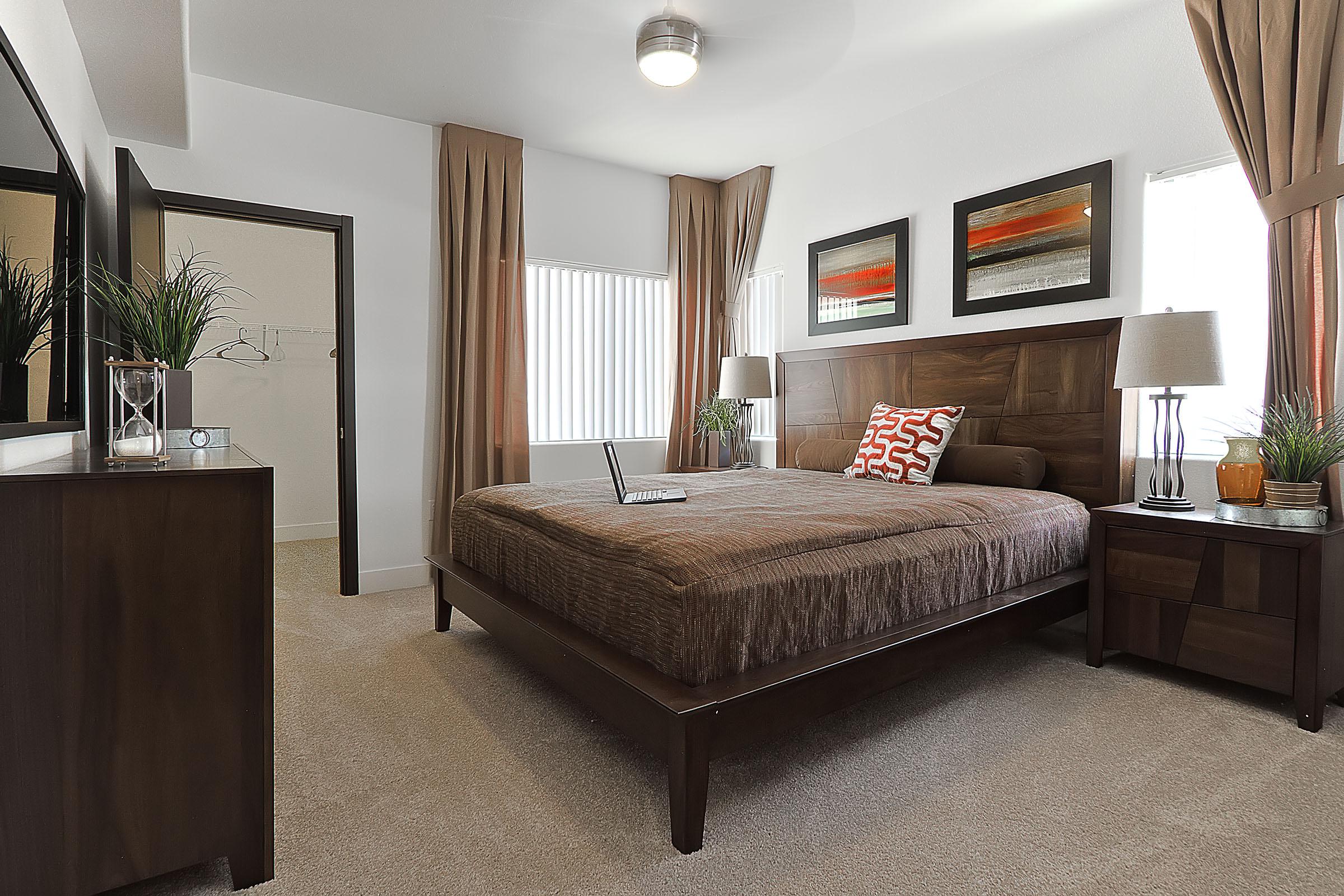 a living room filled with furniture and a large window