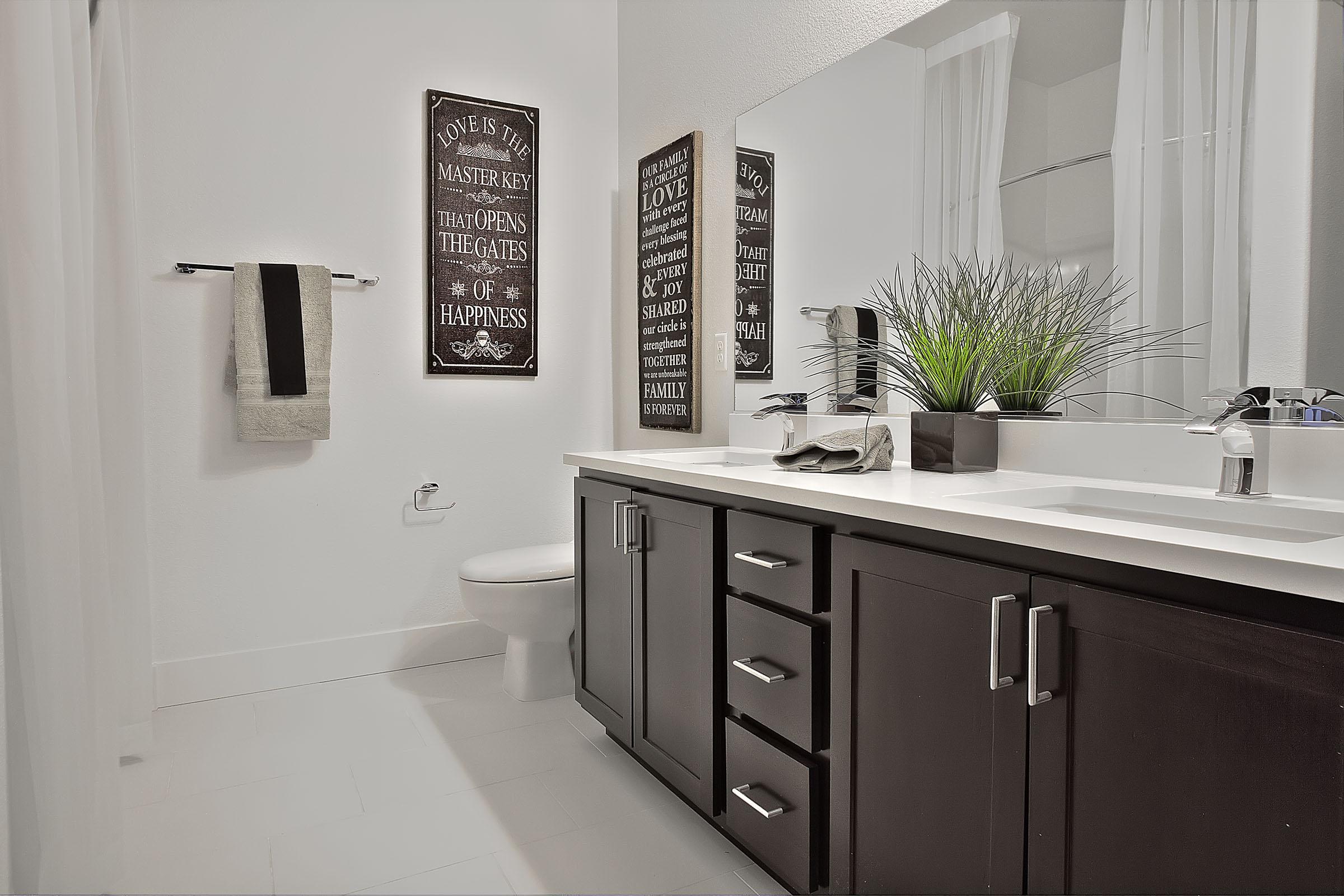 a room with a sink and a mirror