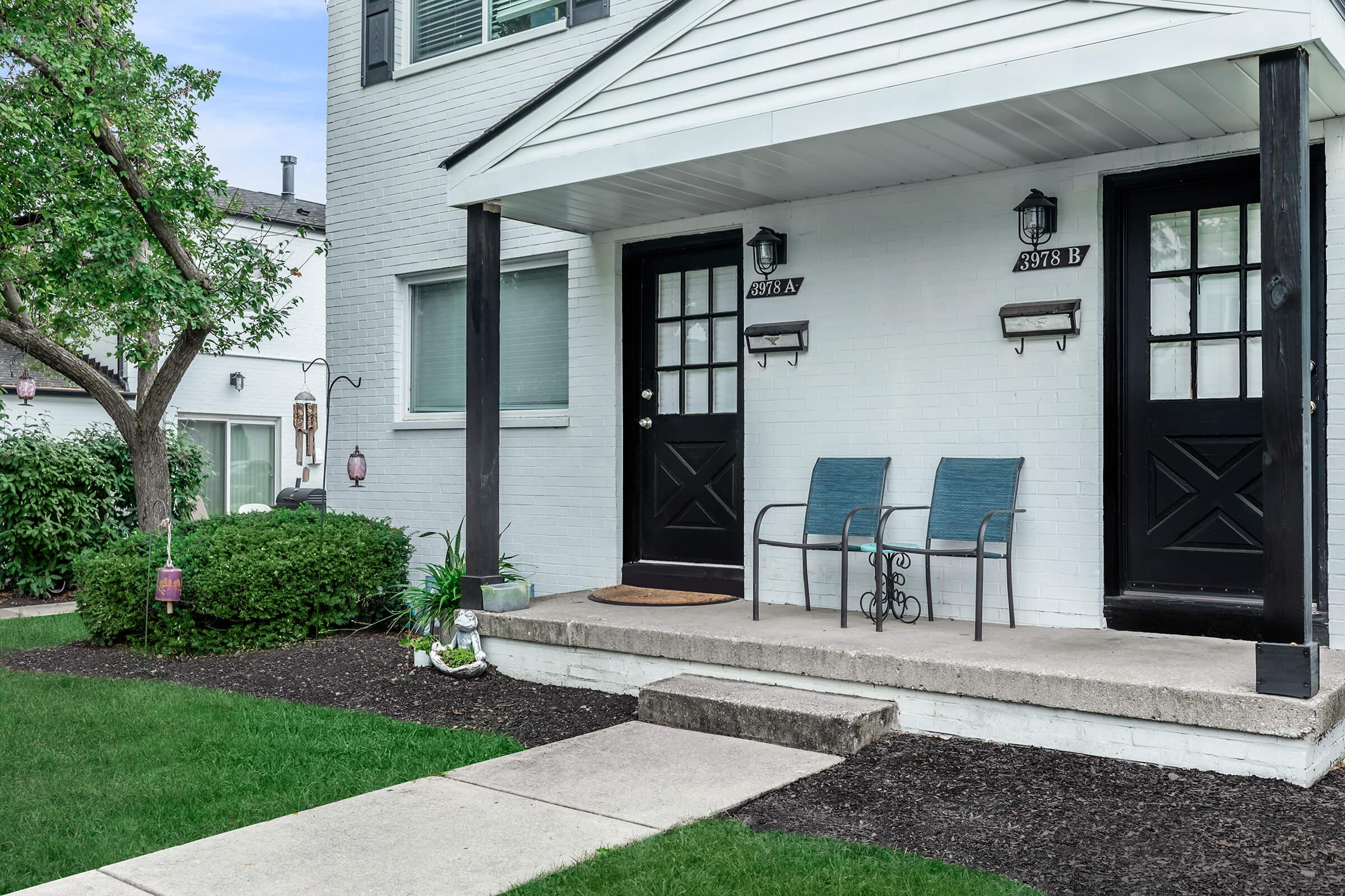 a bench in front of a house