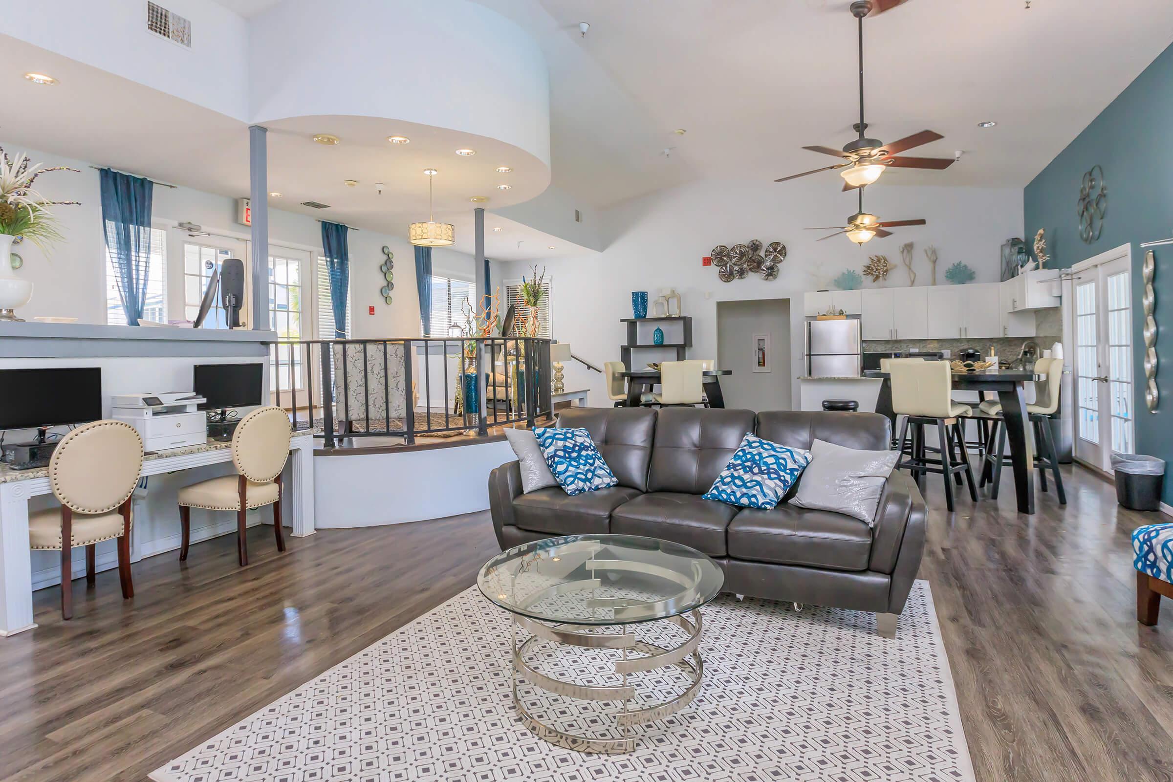 a living room filled with furniture and a fire place