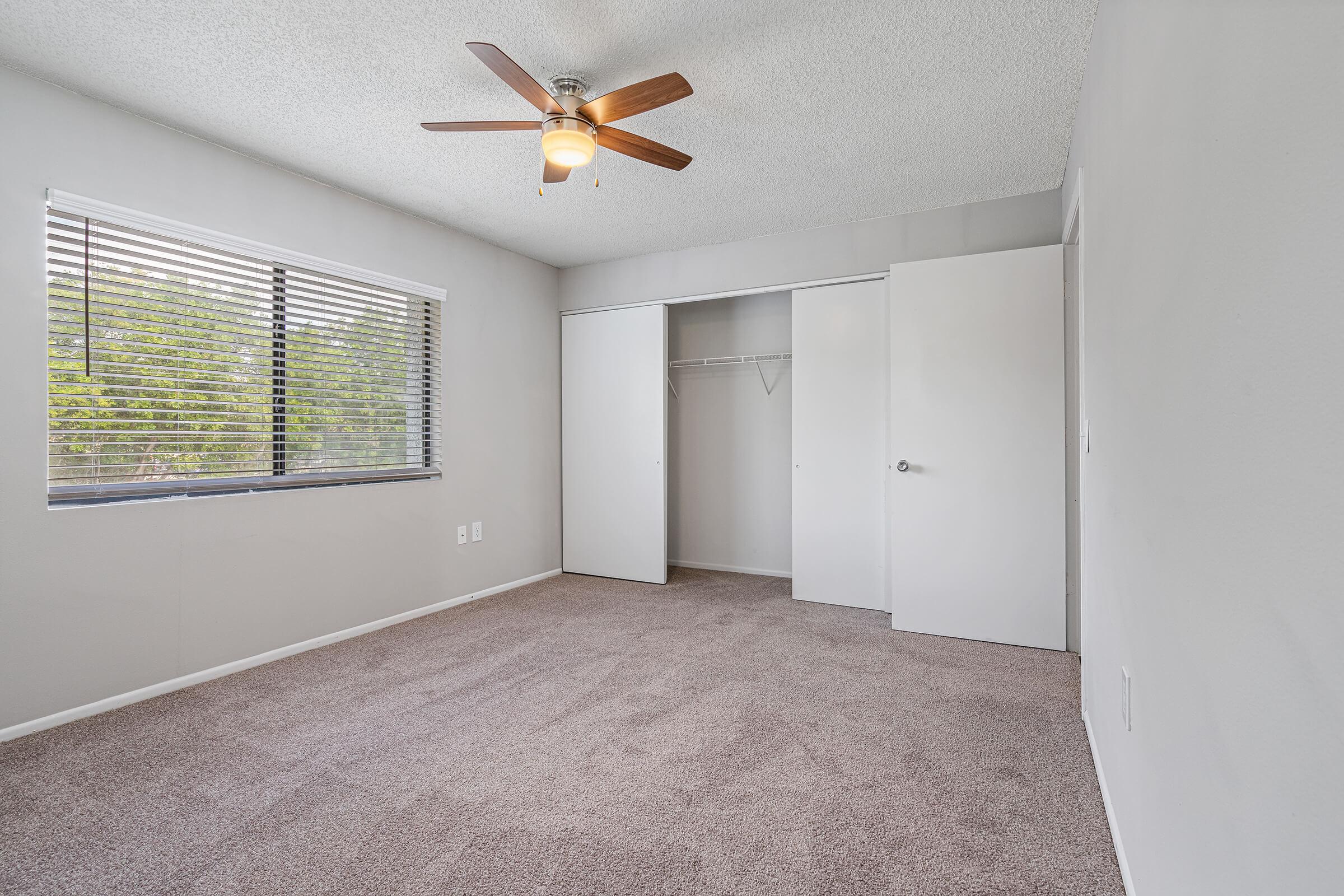 a bedroom with a large window