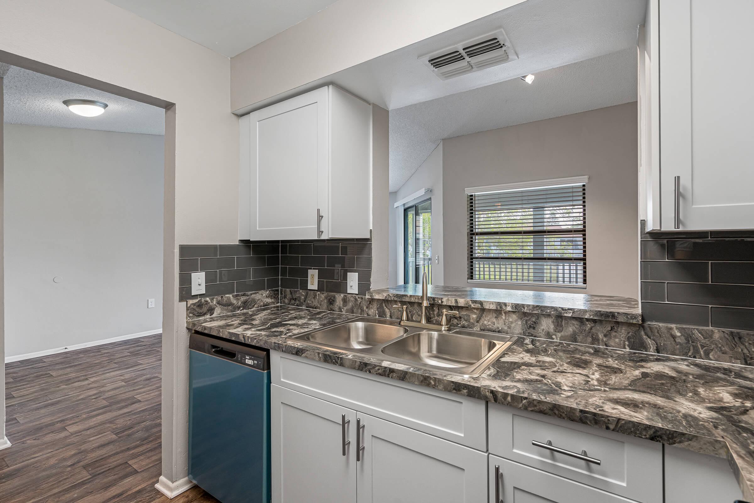 a large kitchen with stainless steel appliances