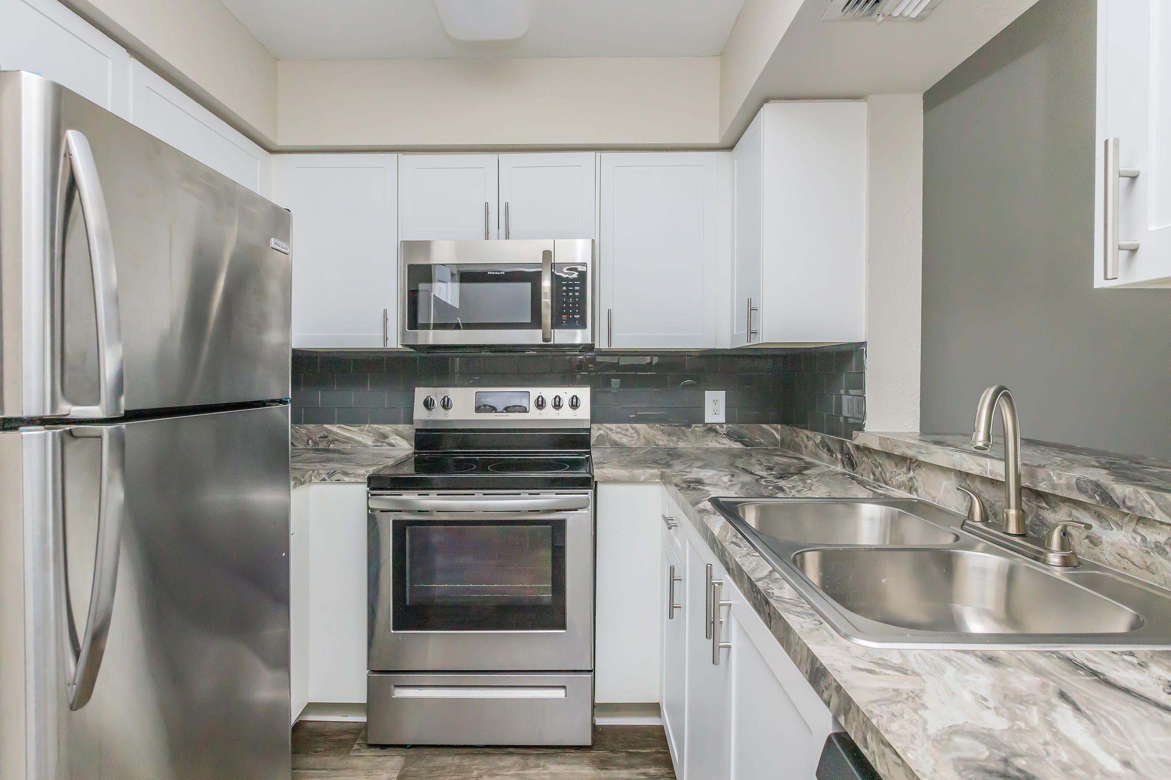 a kitchen with stainless steel appliances