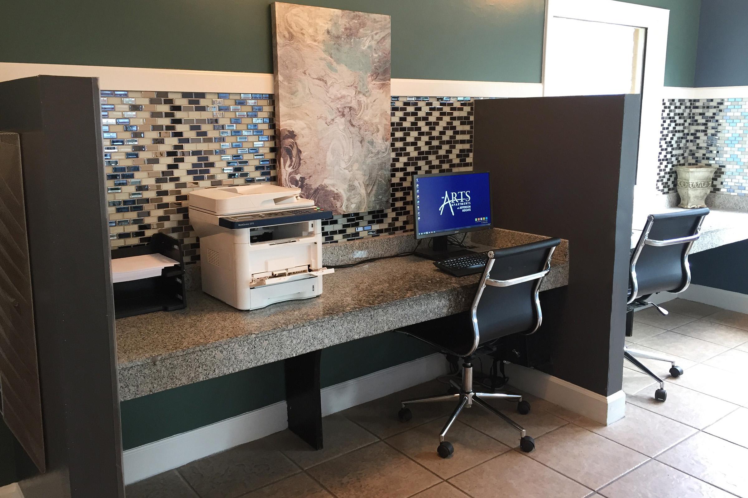 an office with a desk and chair in a room