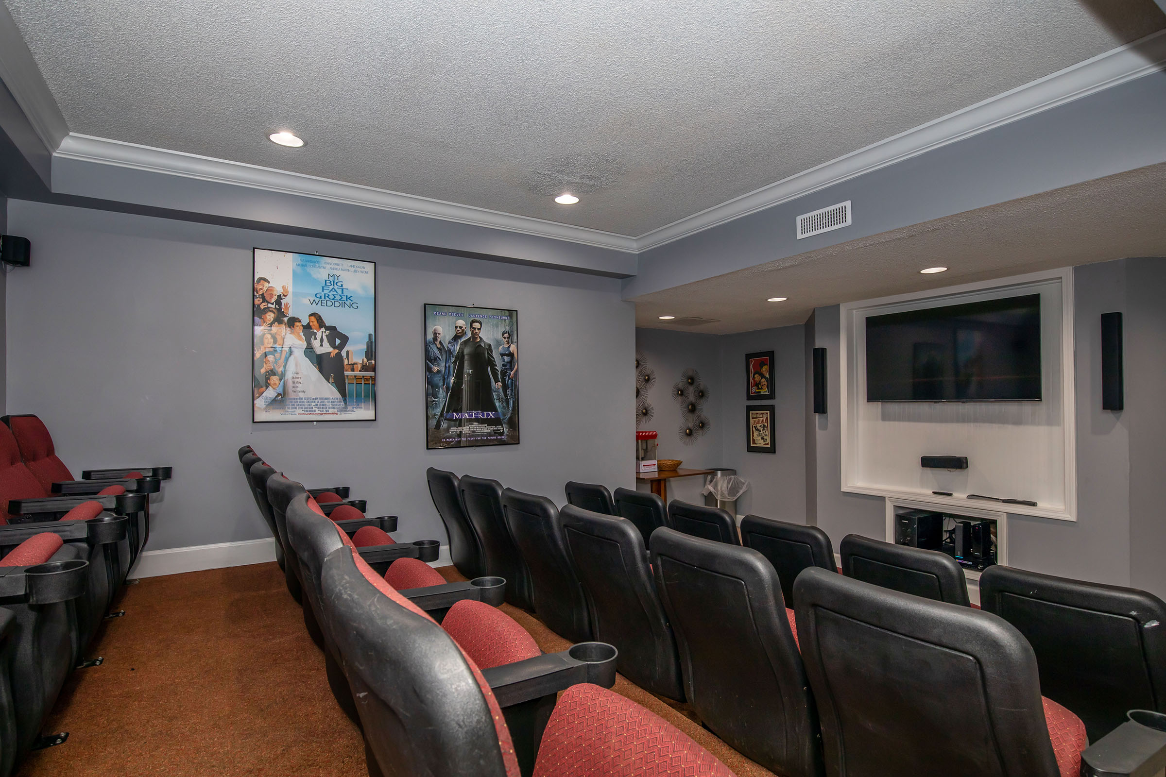 a living room filled with furniture and a flat screen tv