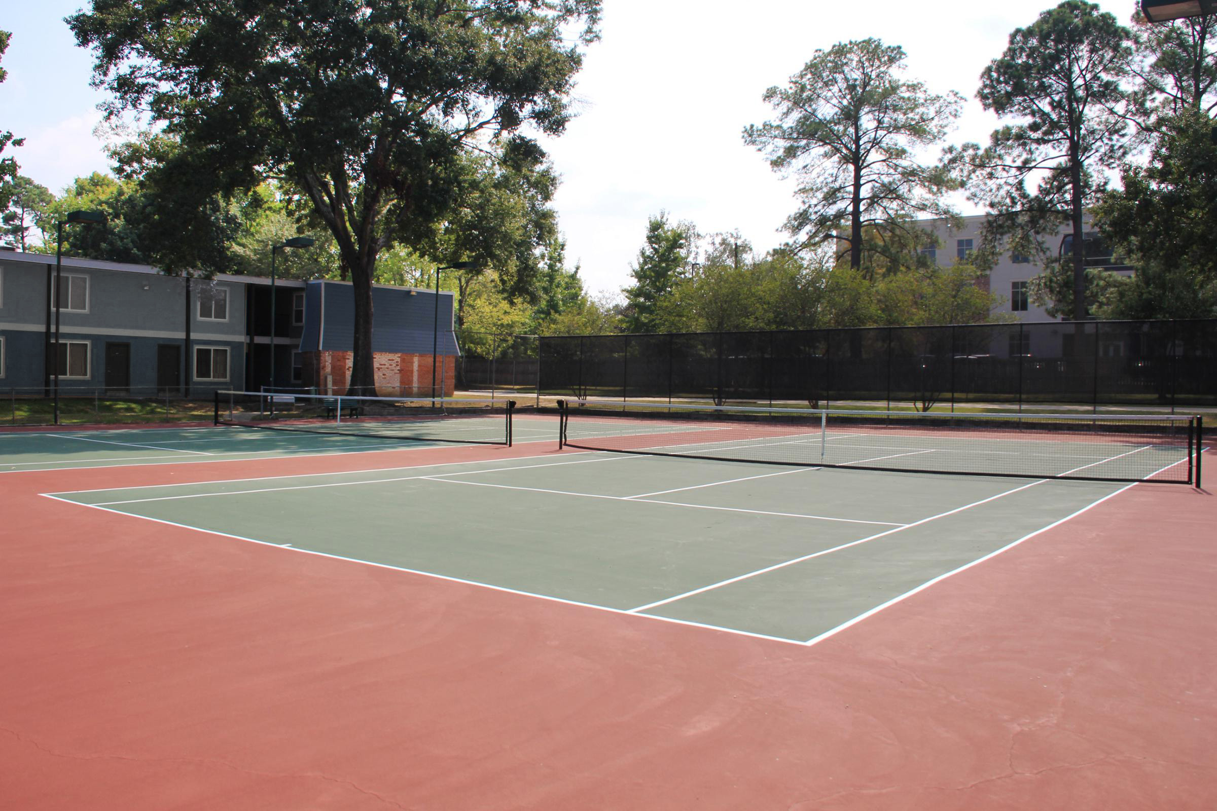 a person on a court with a racket