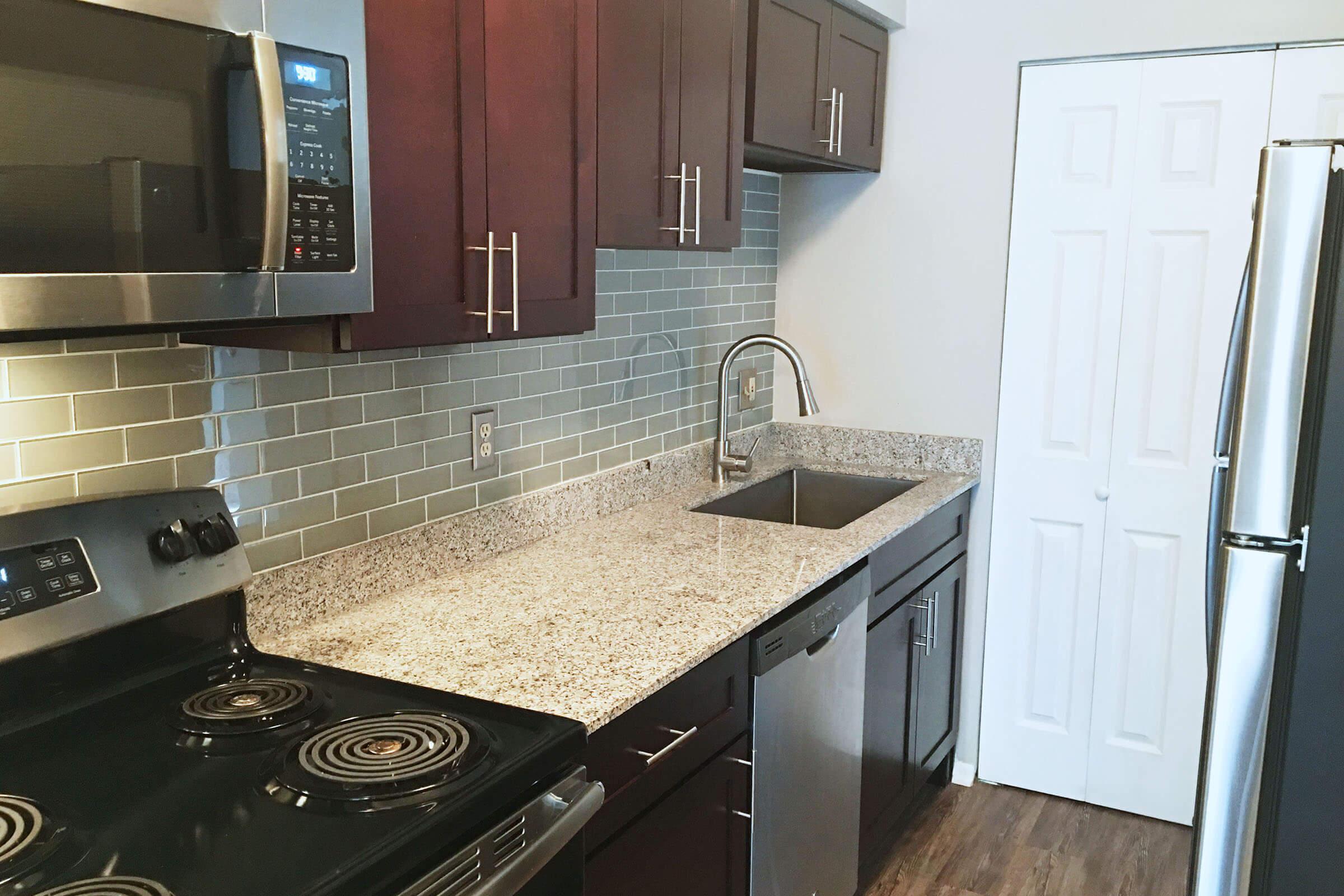 POSH GRANITE COUNTERTOPS AT THE ARTS APARTMENTS IN BATON ROUGE