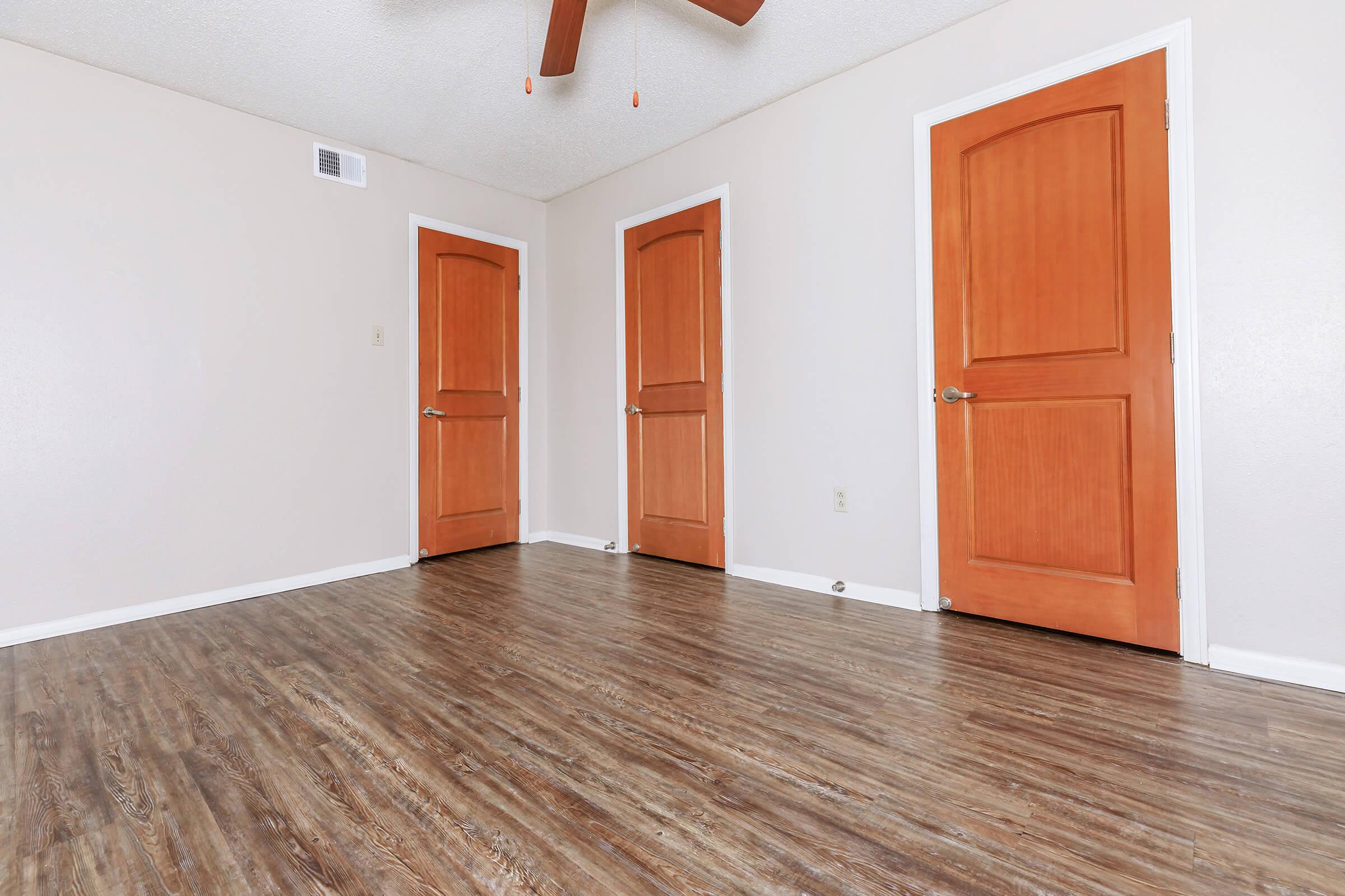 a kitchen with a wood floor