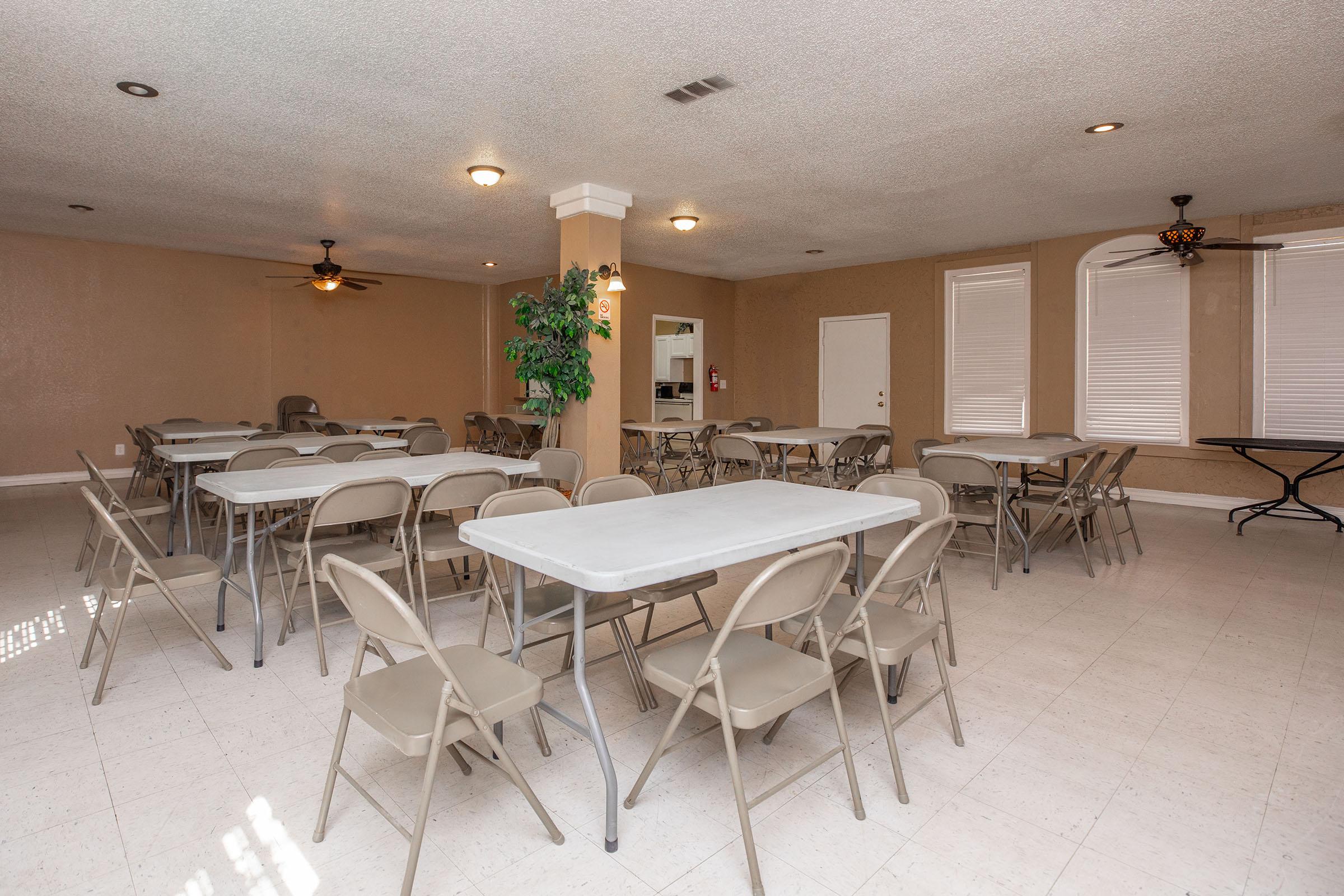 a large room with tables and chairs