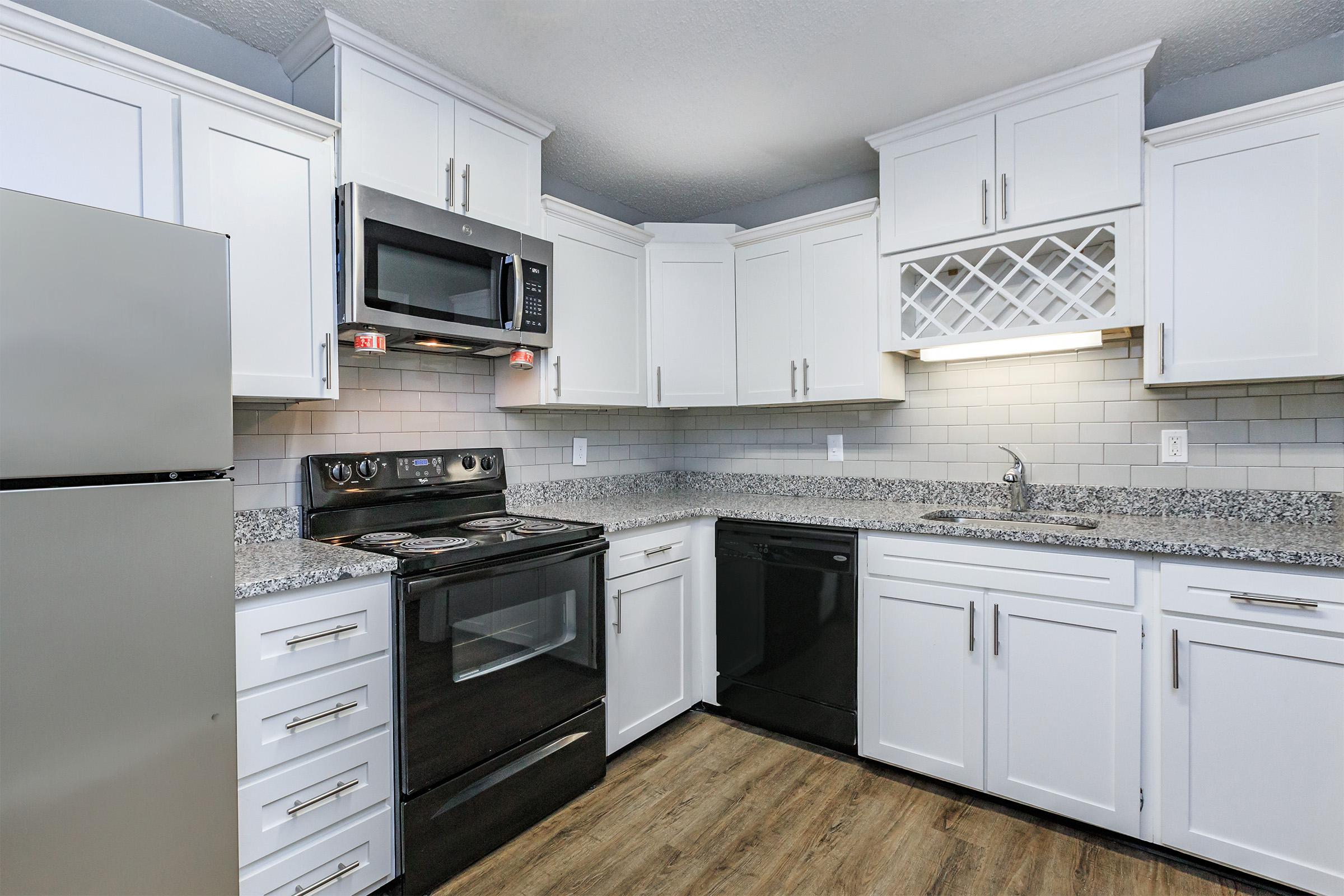 KINGSTON POINTE APARTMENTS HAS BLACK AND STEEL APPLIANCES