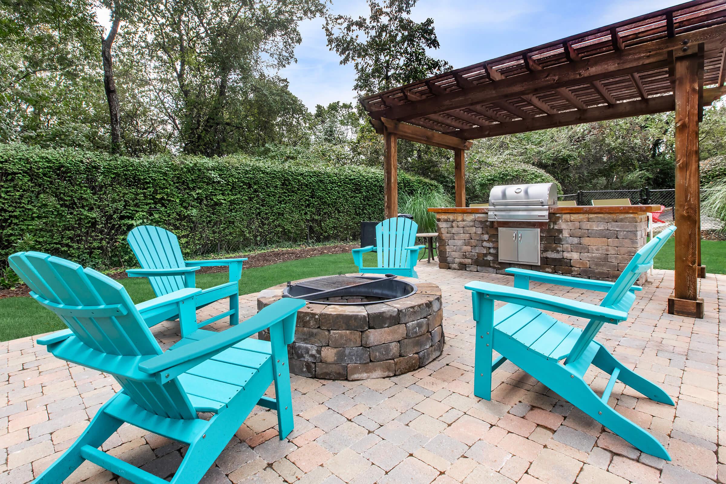 a couple of lawn chairs sitting on top of a picnic table