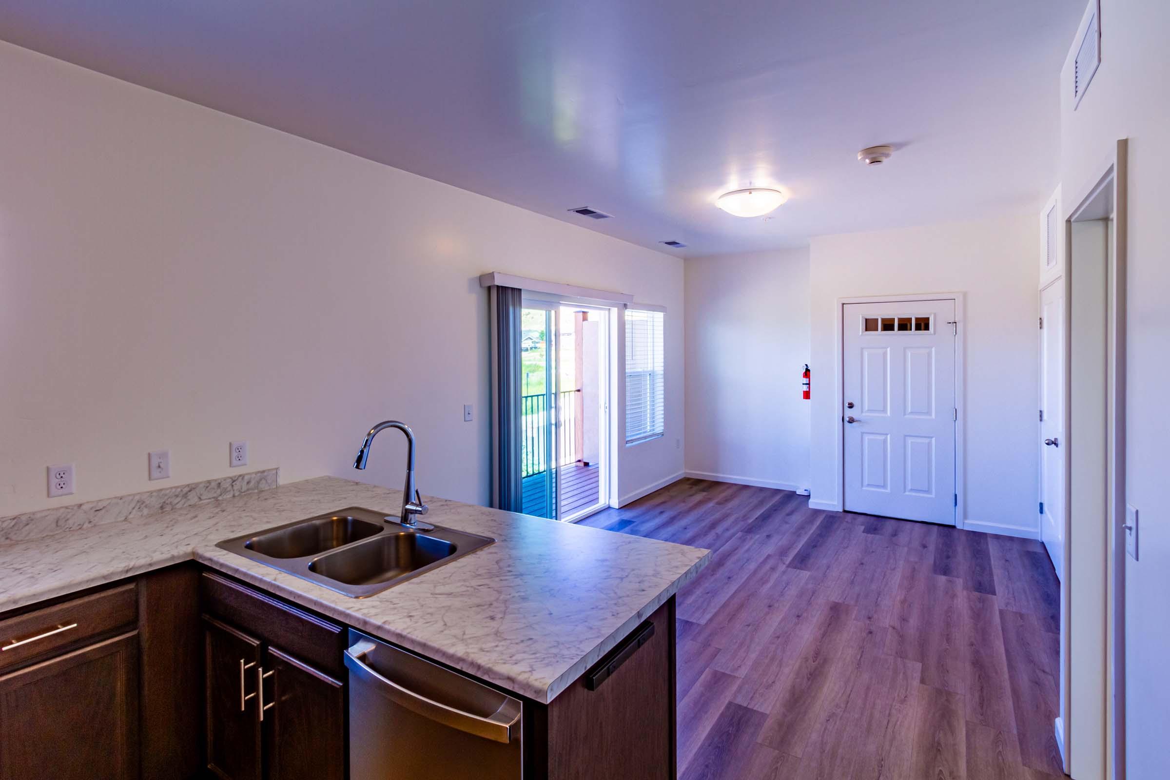 a kitchen with a sink and a window