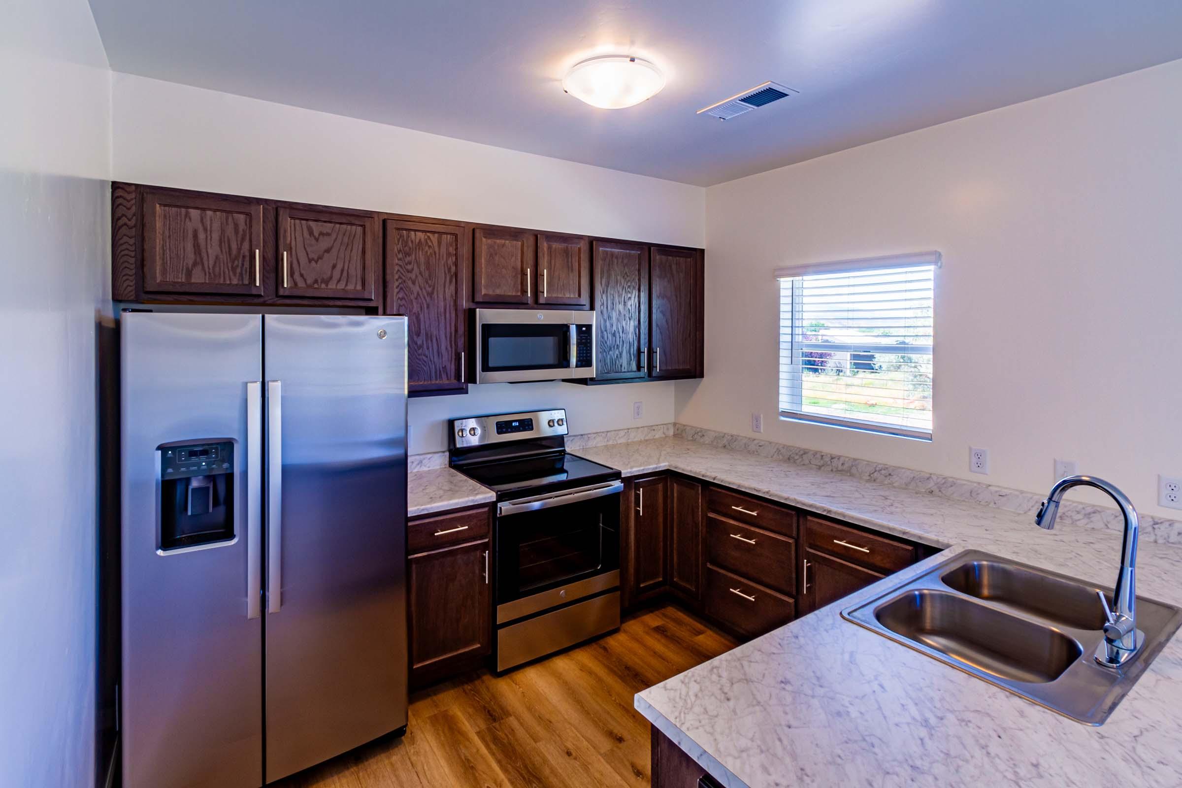 a modern kitchen with stainless steel appliances