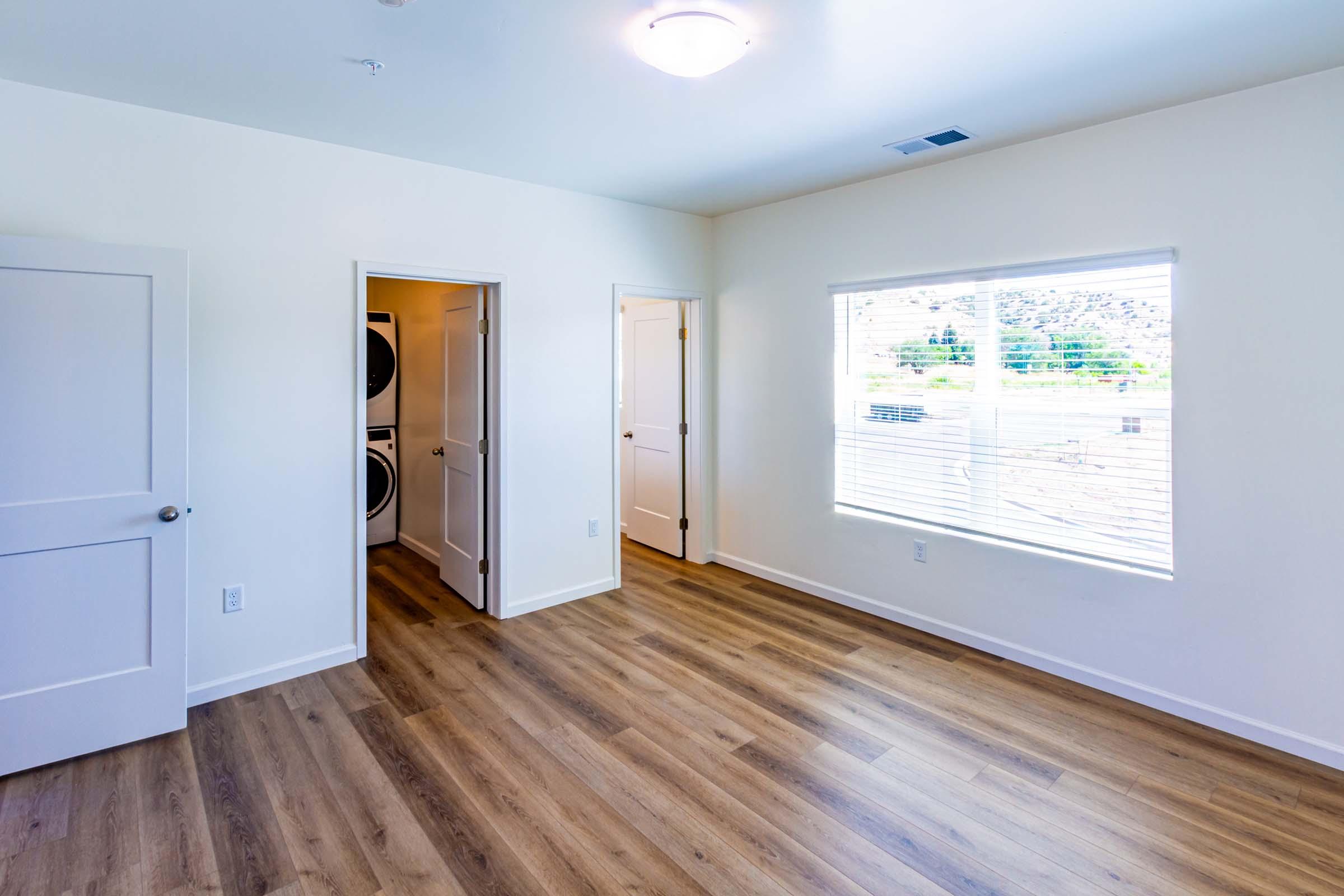 a kitchen with a hard wood floor