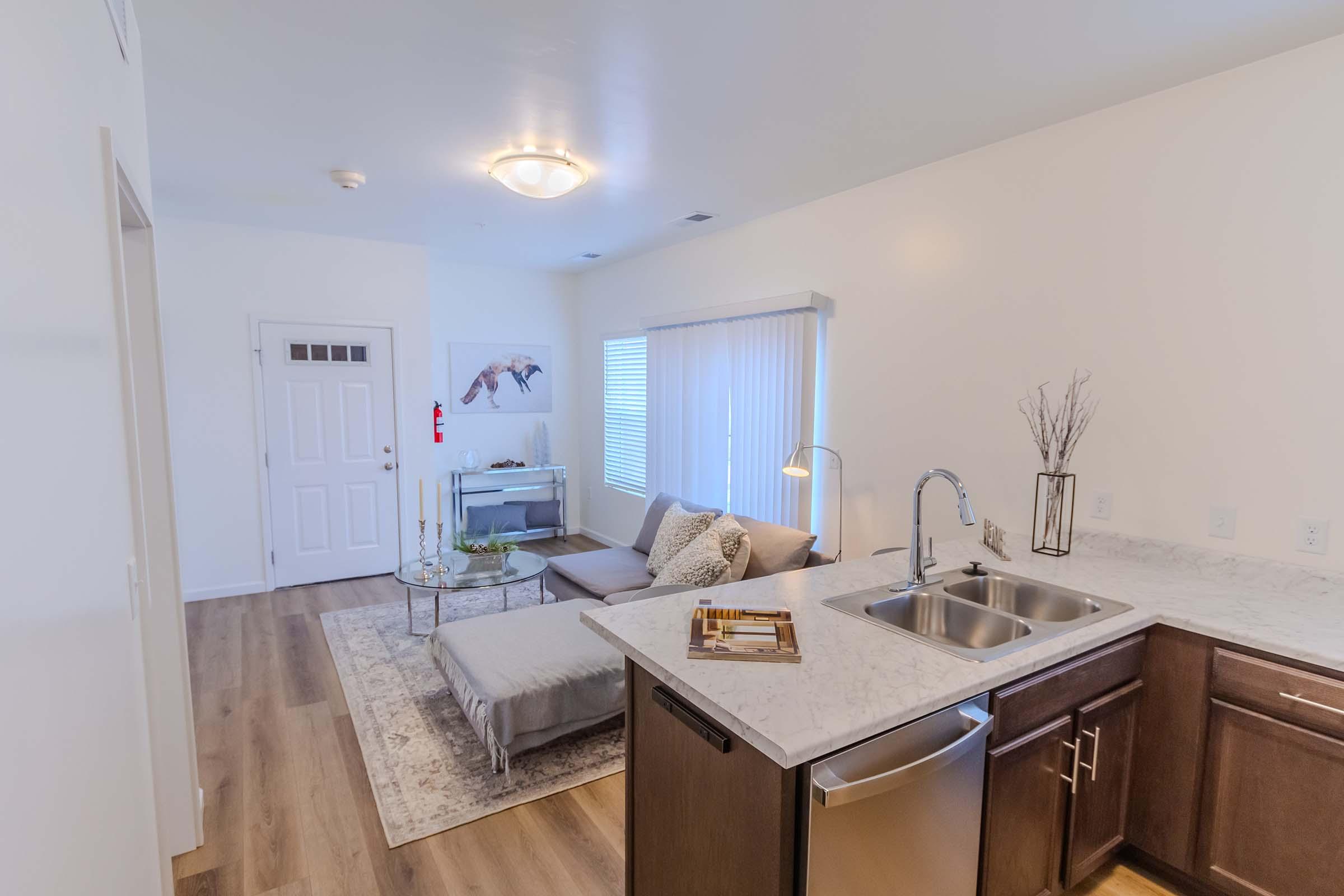 a kitchen with a sink and a window