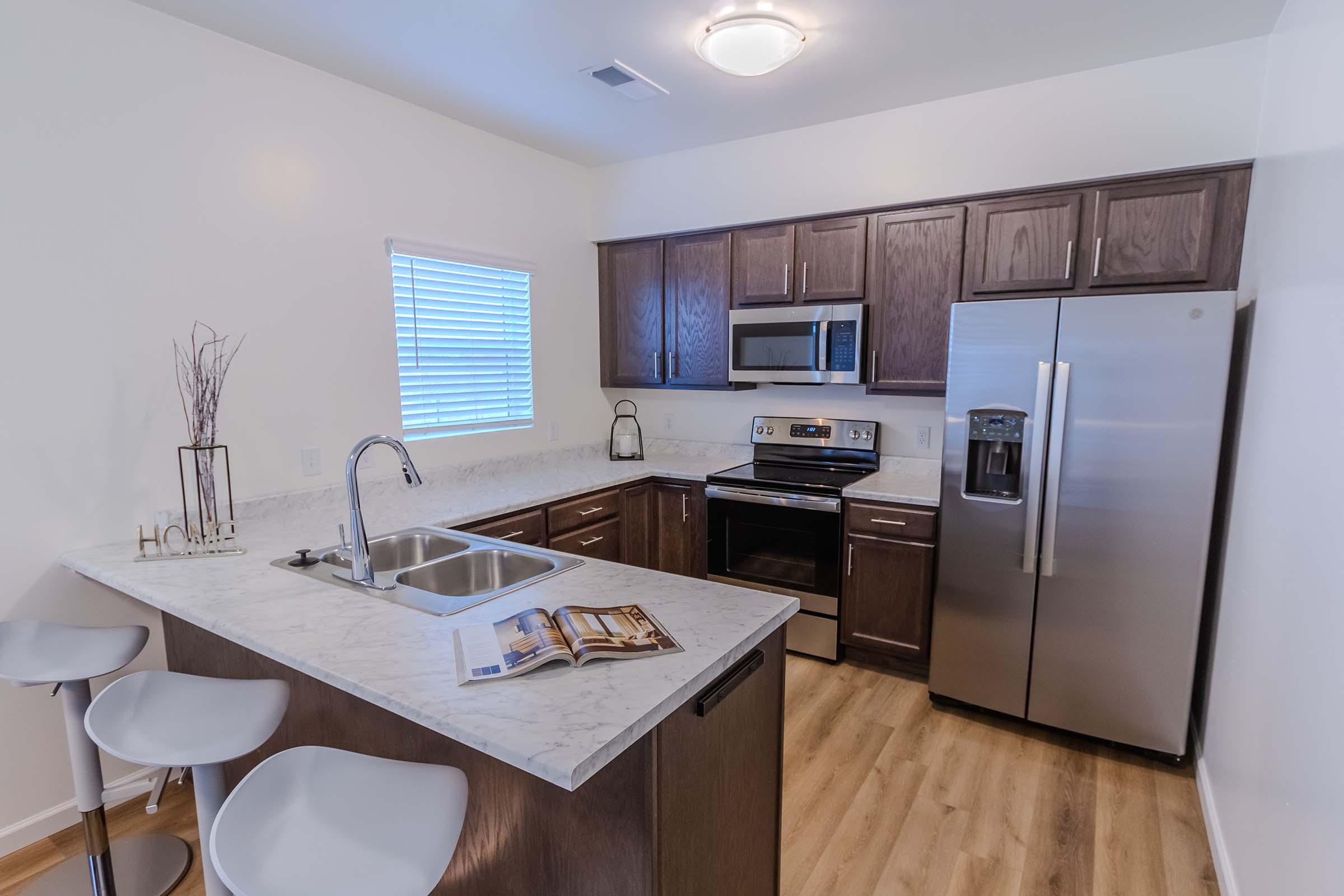 a kitchen with an island in the middle of a table