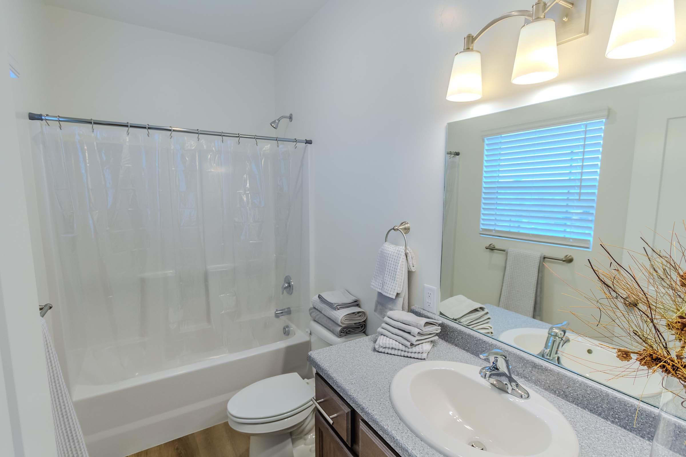 a room with a sink and a shower