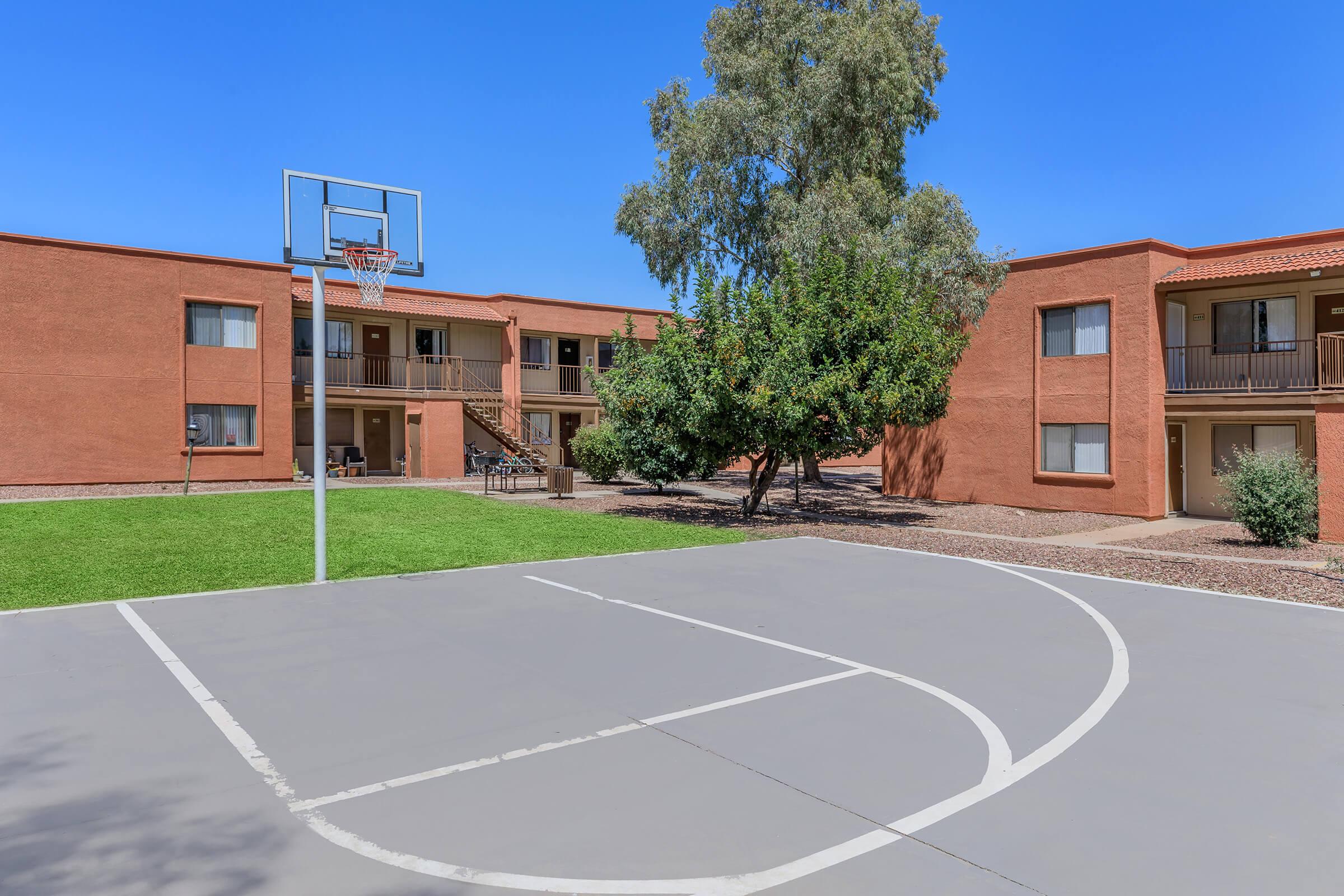 a large brick building with a basketball