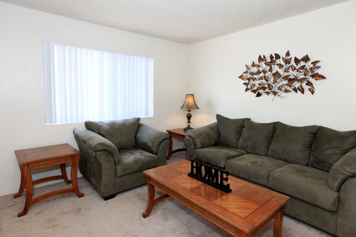 a living room filled with furniture and a table