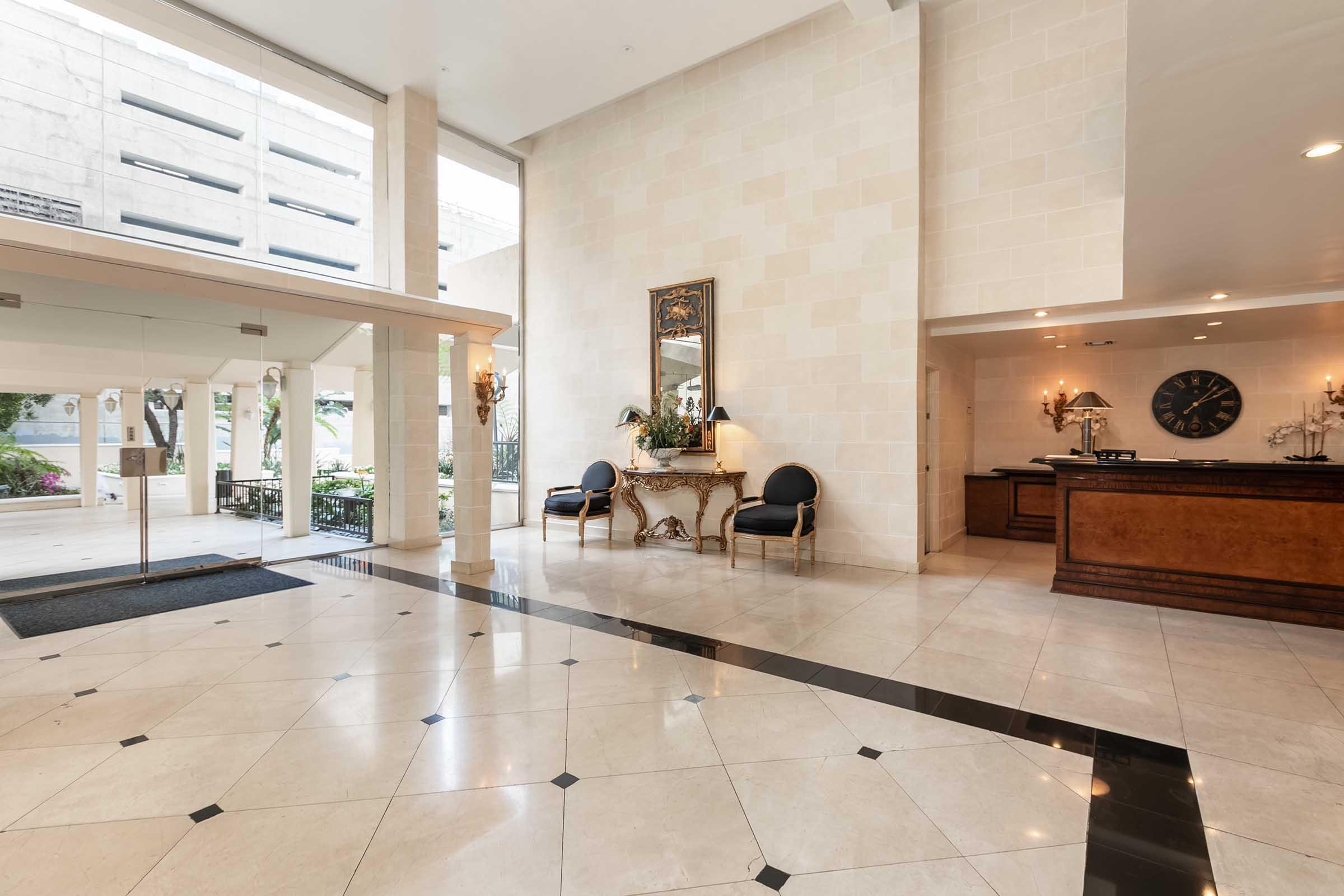 a lobby filled with furniture and a large window