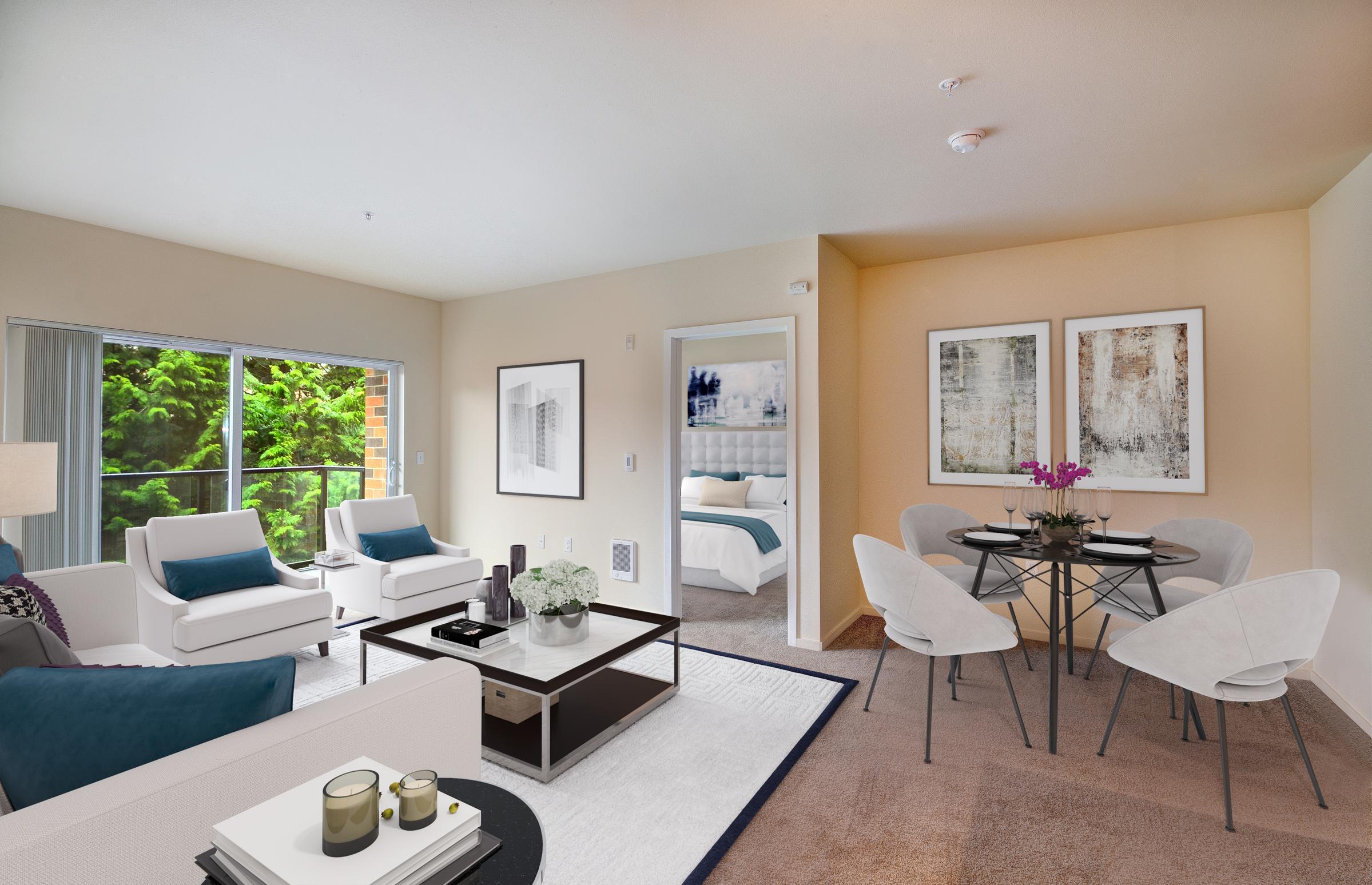 a living room filled with furniture and a table