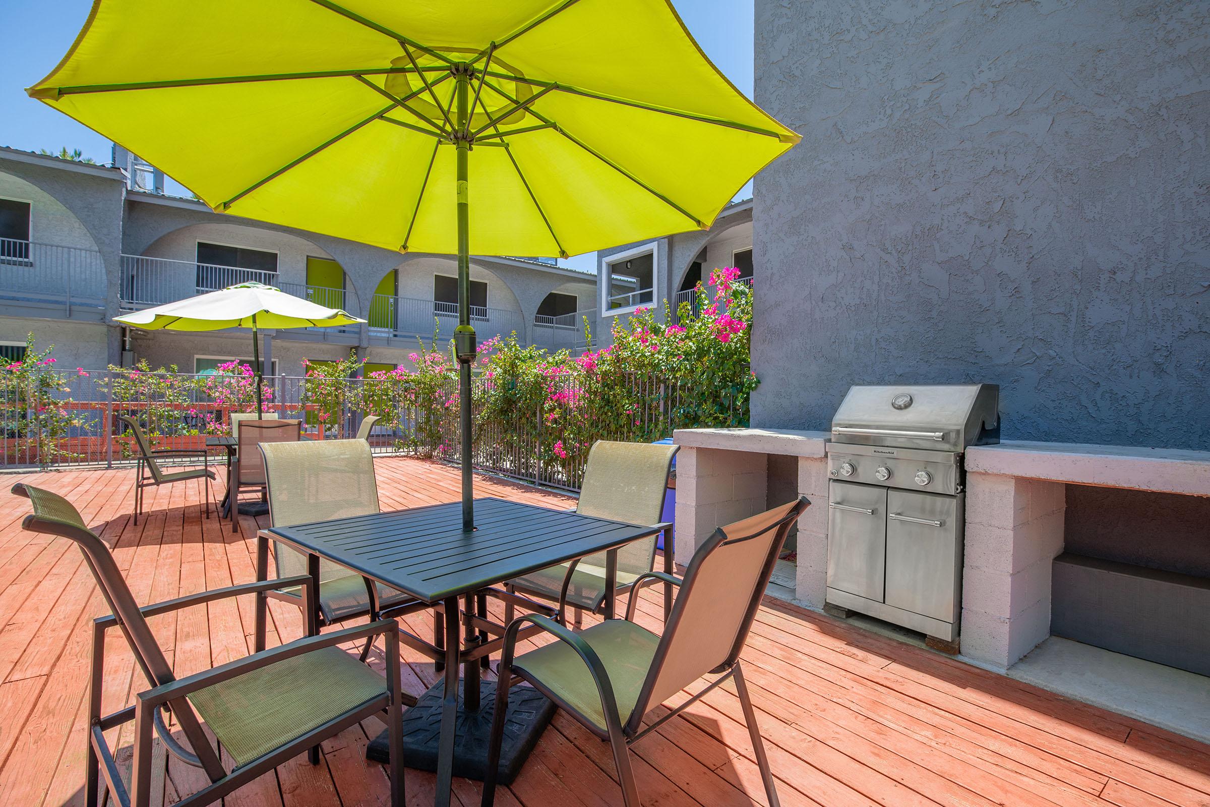 a table topped with a blue umbrella