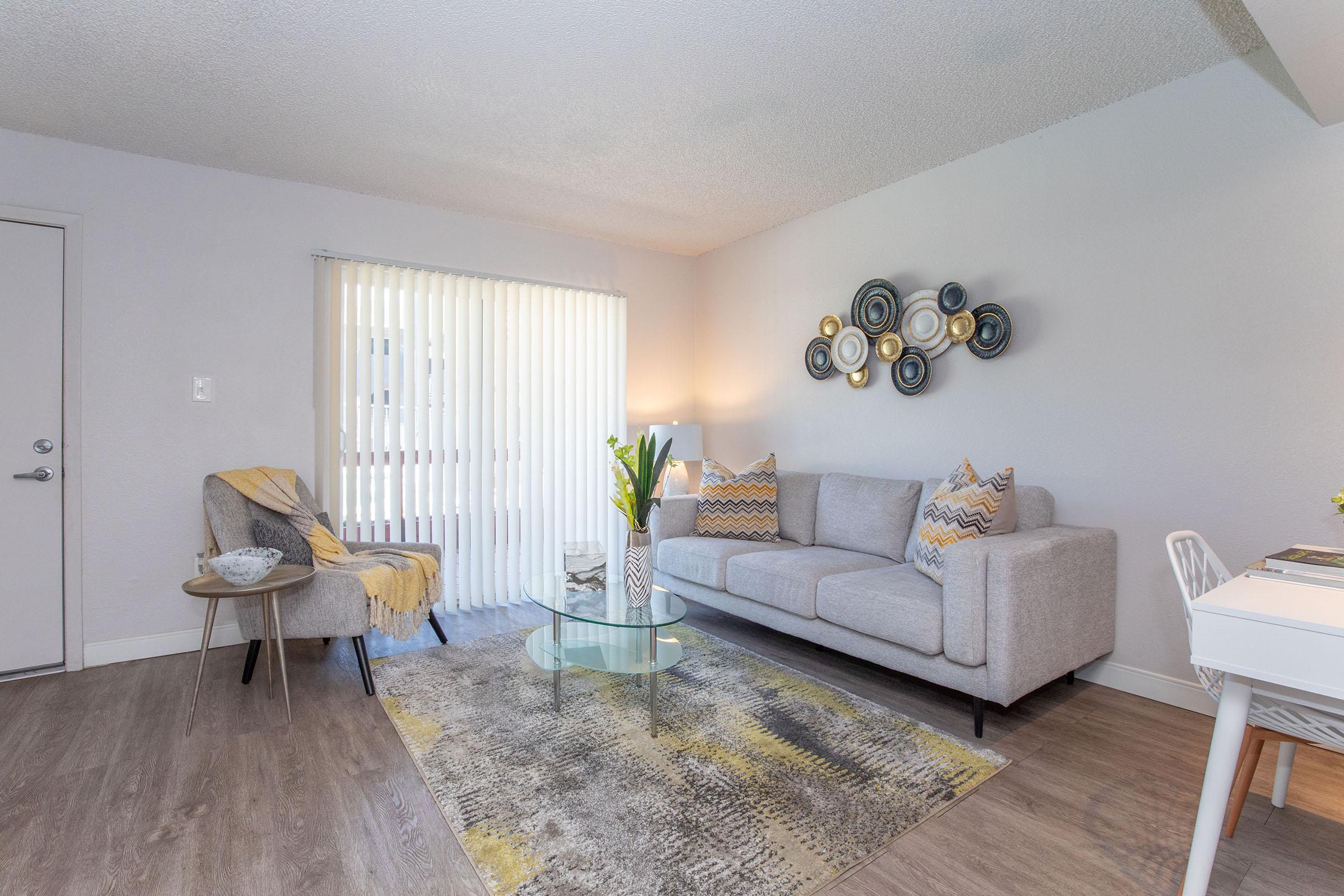 a living room filled with furniture and a table