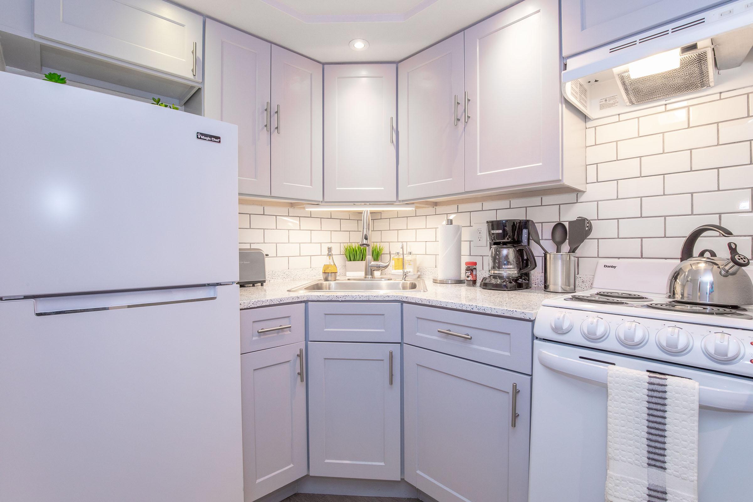 a kitchen with a sink and a microwave