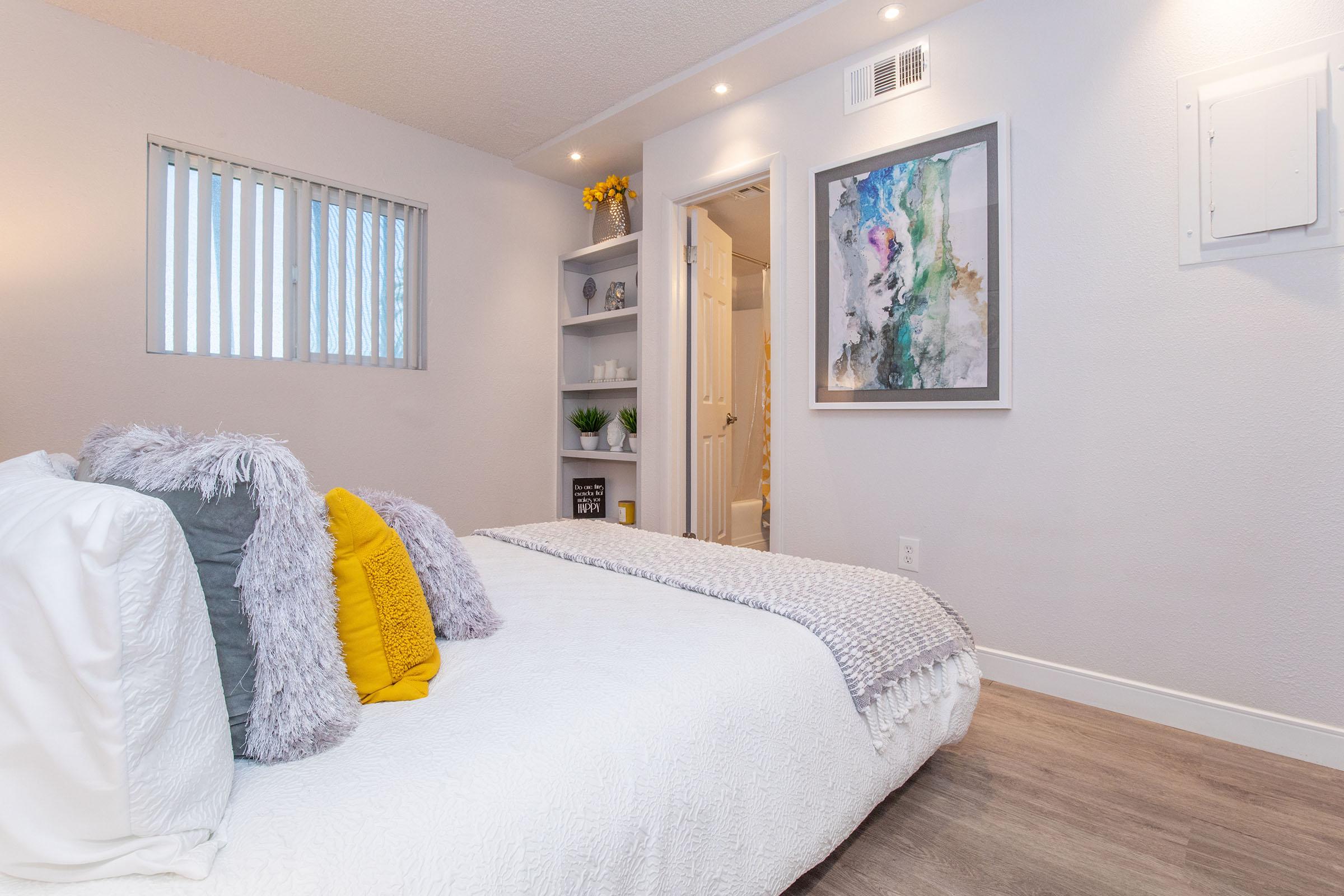 a bedroom with a large bed sitting in a room