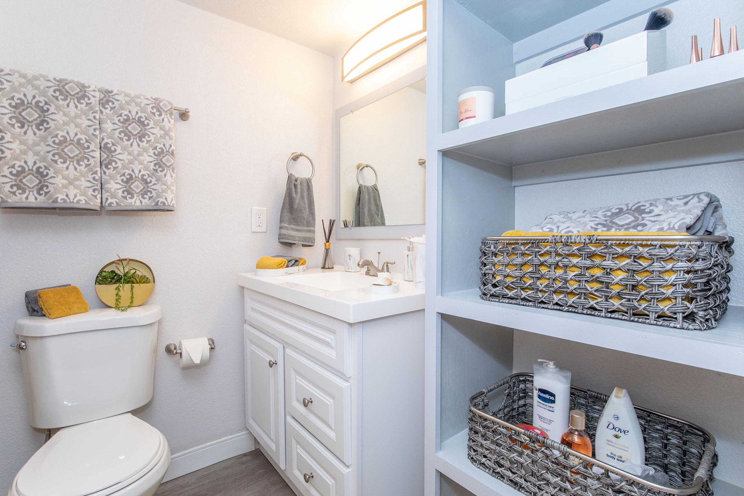 a kitchen with a sink and a mirror