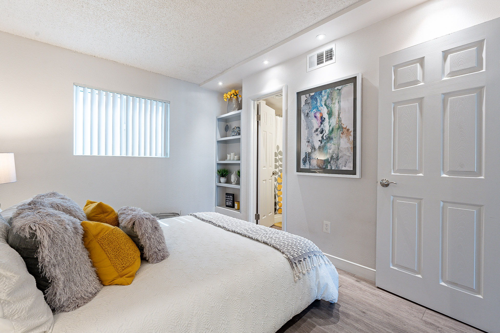 a bedroom with a large bed in a room