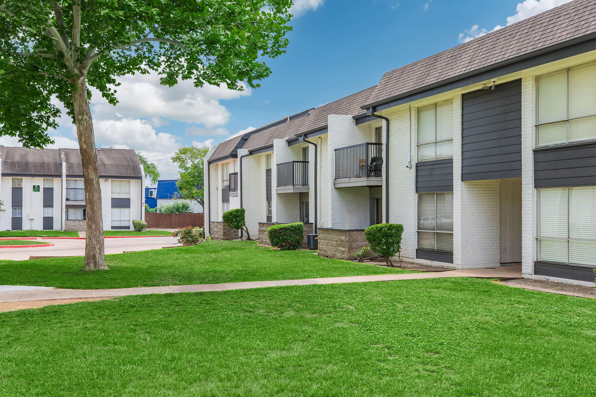 a large lawn in front of a house