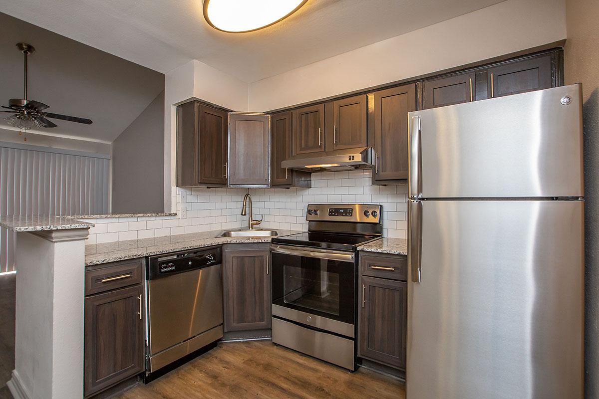 a stainless steel refrigerator in a kitchen