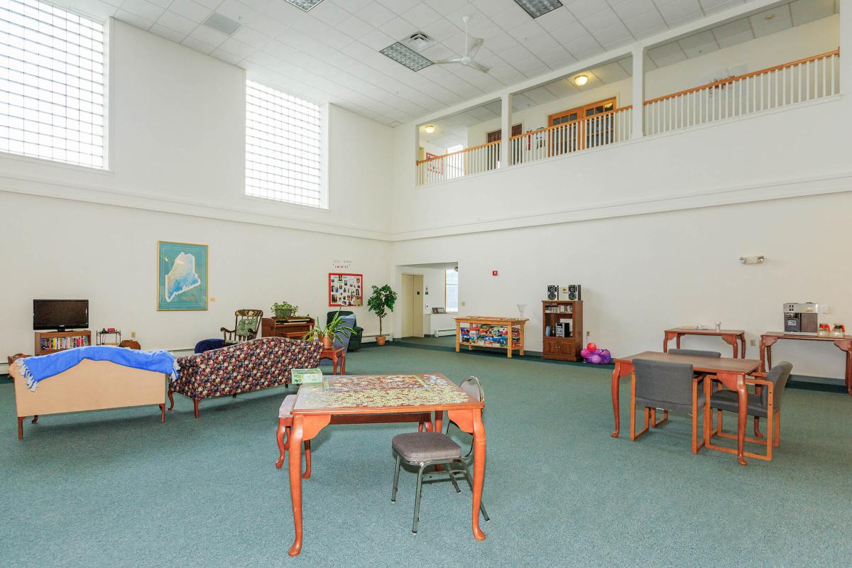 a room filled with furniture and a table