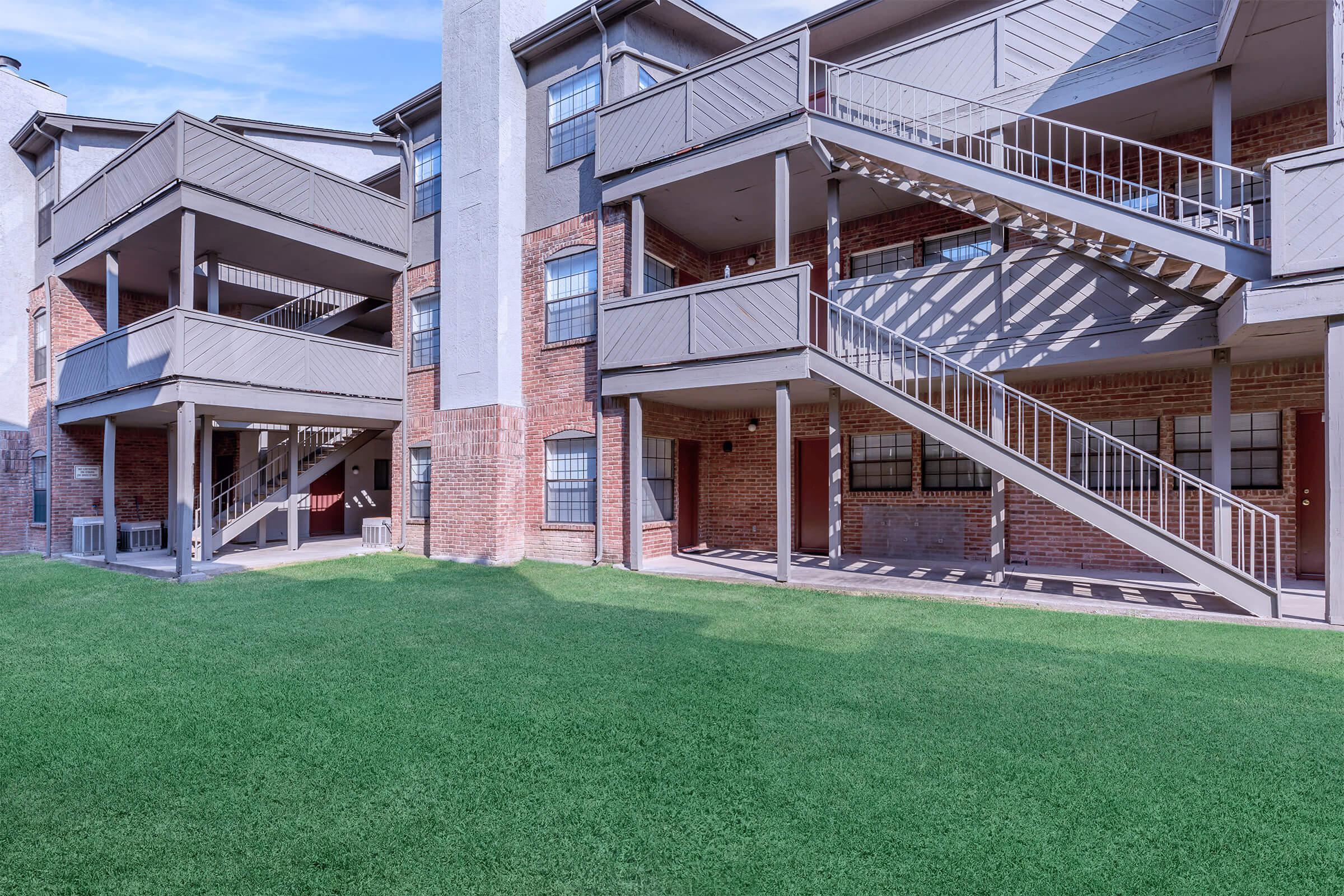 a large lawn in front of a building