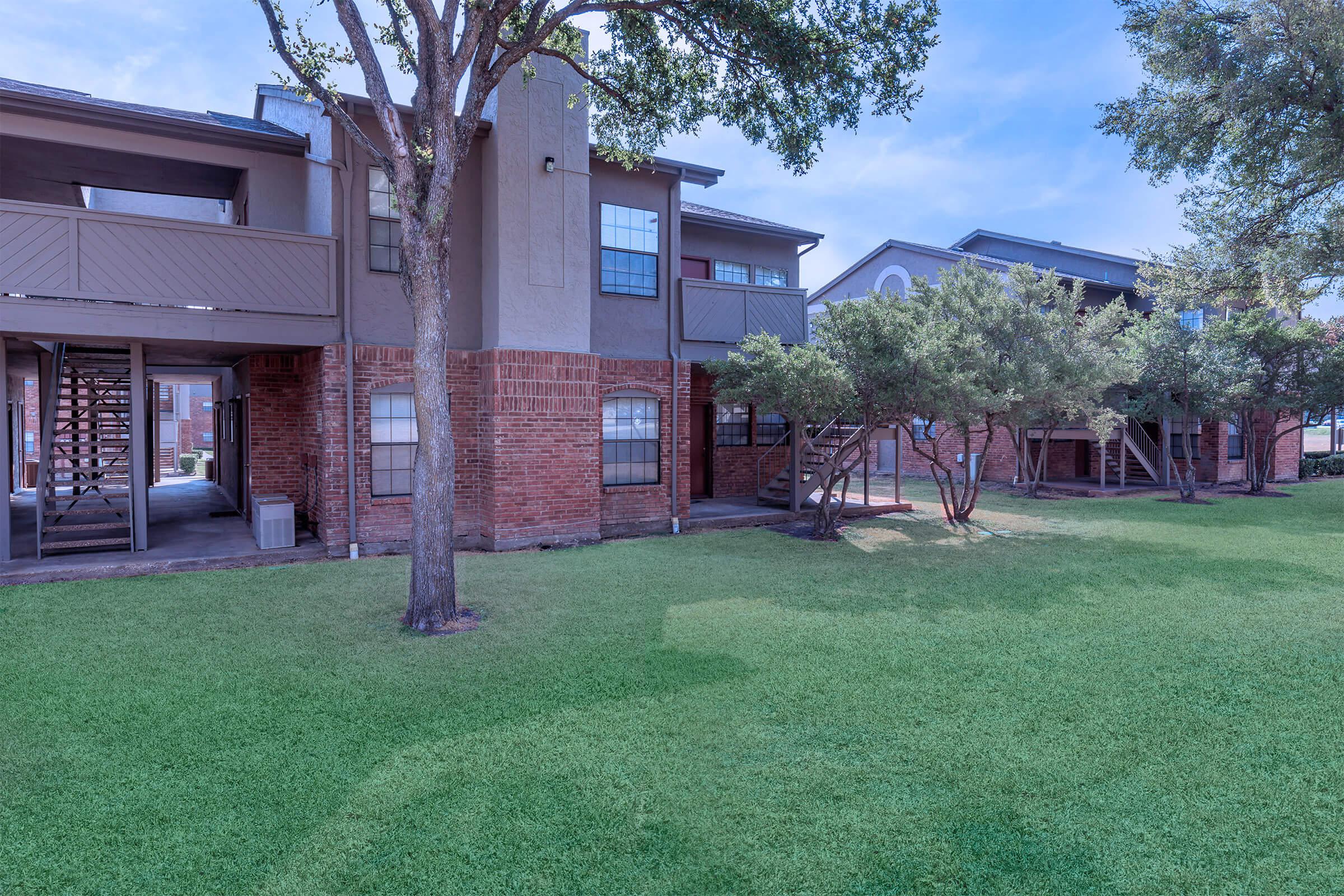 a large lawn in front of a house