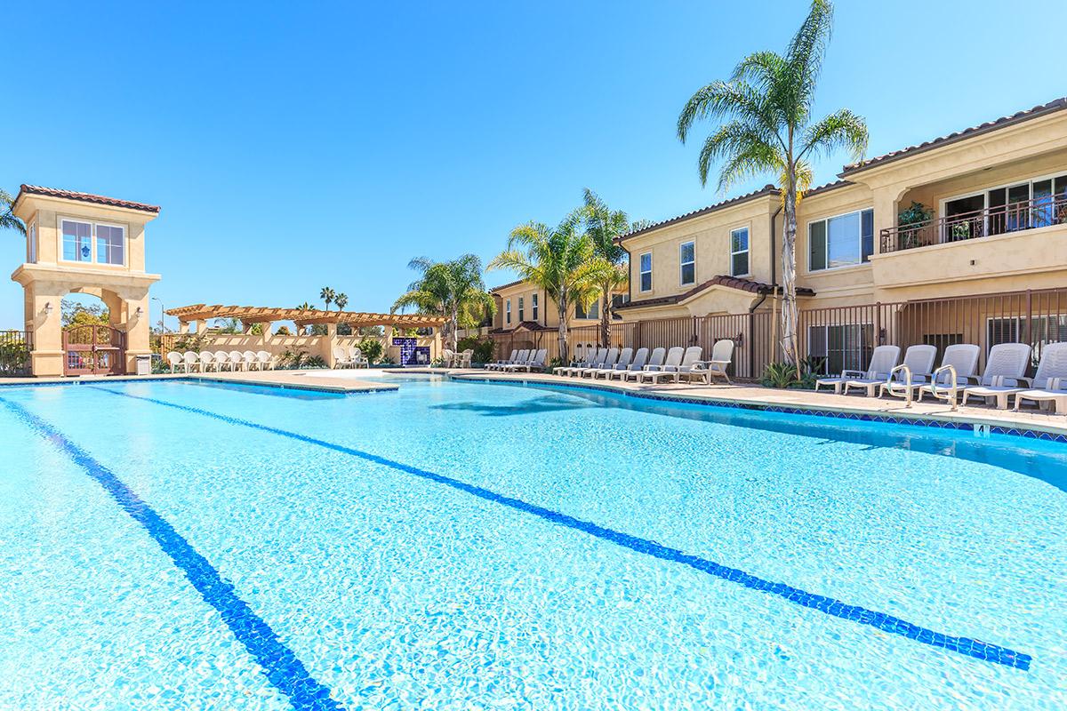 a house with a pool outside of a building