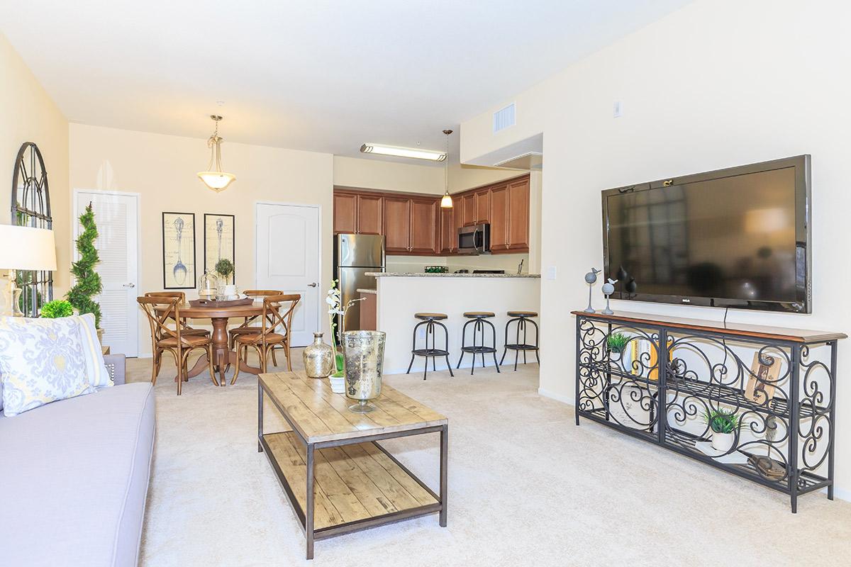 a living room filled with furniture and a fireplace